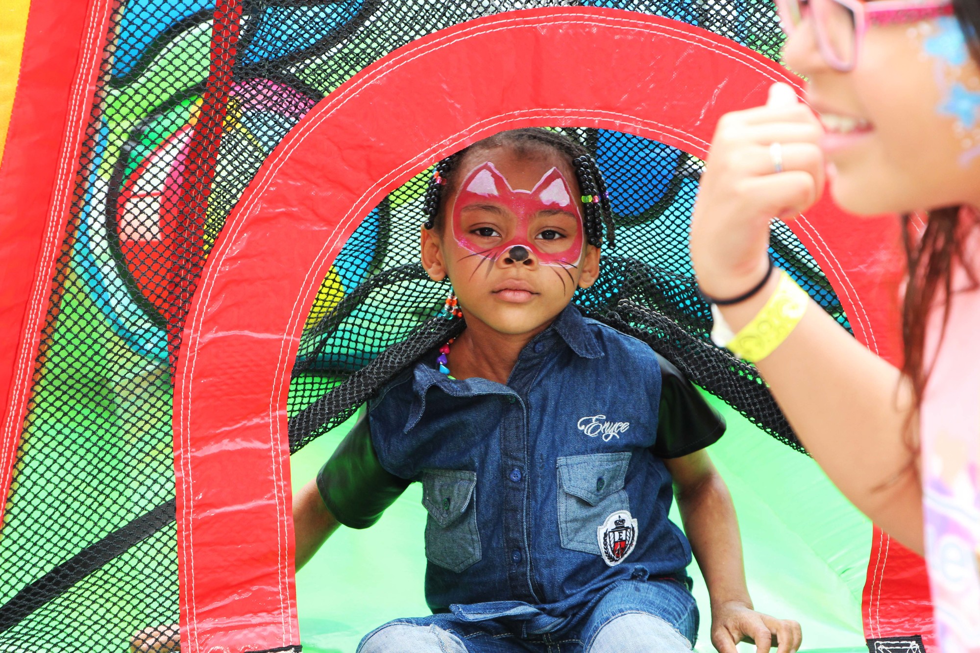 Madison Mayers, 4, took a spin in the bounce house and had her face painted.