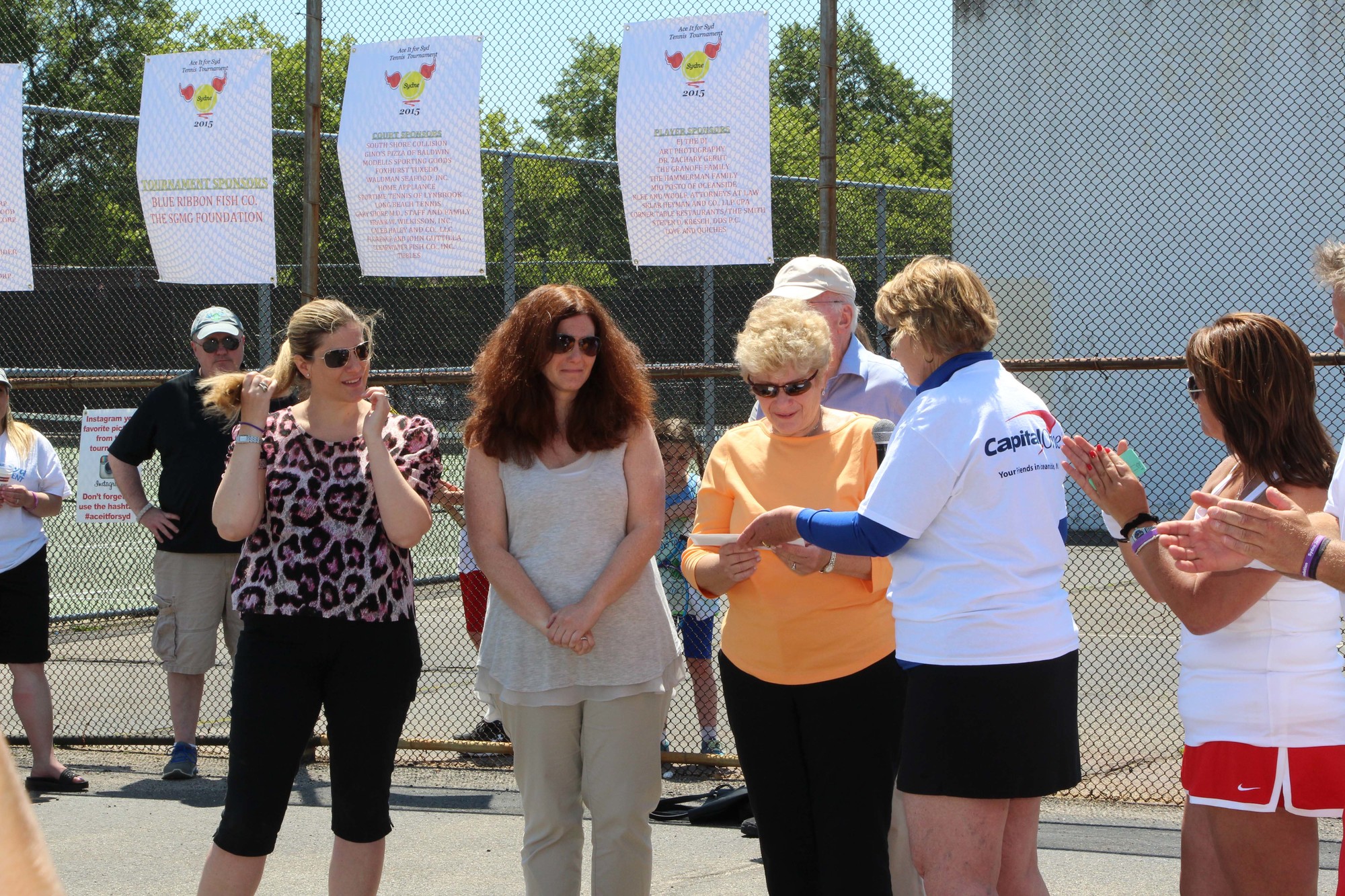 Susan Aldy’s family, Debbie Semaya, Rachel Renkin and Judy Weiss, accepted a presentation in her memory.