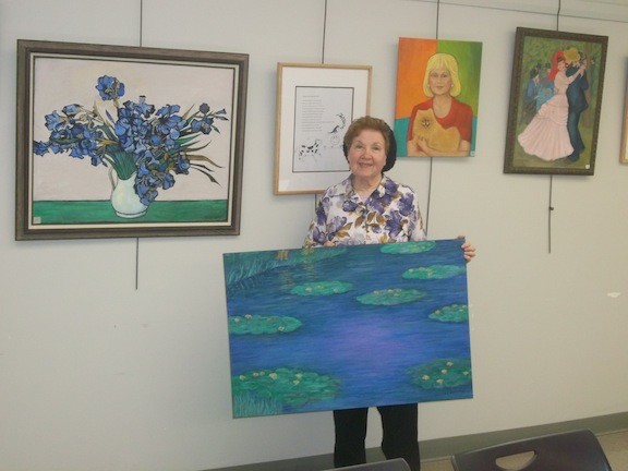 Ruth Lawrence, 88, with some of the pieces she has on display at the Wantagh Public Library through July.