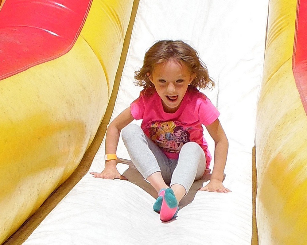 Vita Corbett, 5, took a ride down the slide at the Frolic.