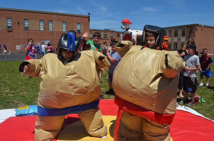Fifth graders Robert Adler and John Gleeson sumo wrestled