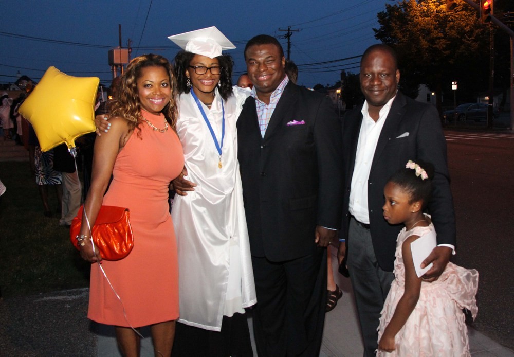 Graduate Christell Pascal, 14, marked her achievement with, from left, her mother, Roserlande Chery, her father, Richard Pascal, step-father, Mousslin Lamour and sister Isabella Lamour, 6.