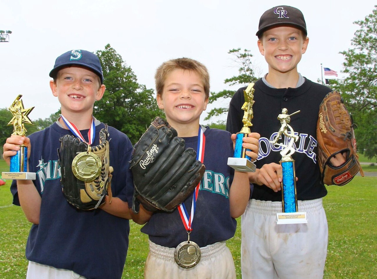 It was a successful season for the Kirchner brothers, from left, Logan, 9, Preston, 7, and Zachary, 10. They each received trophies during the Baldwin Little League closing ceremony in June 20.