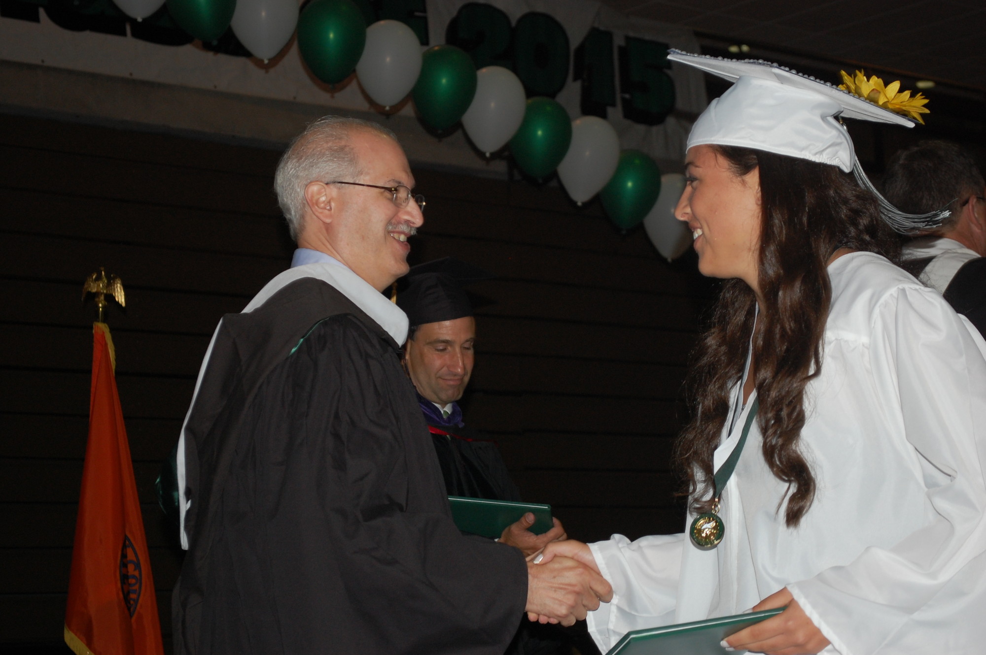 Board of Education President Bruce Kahn congratulated Shannon Duncan as she came up on stage to receive her diploma.