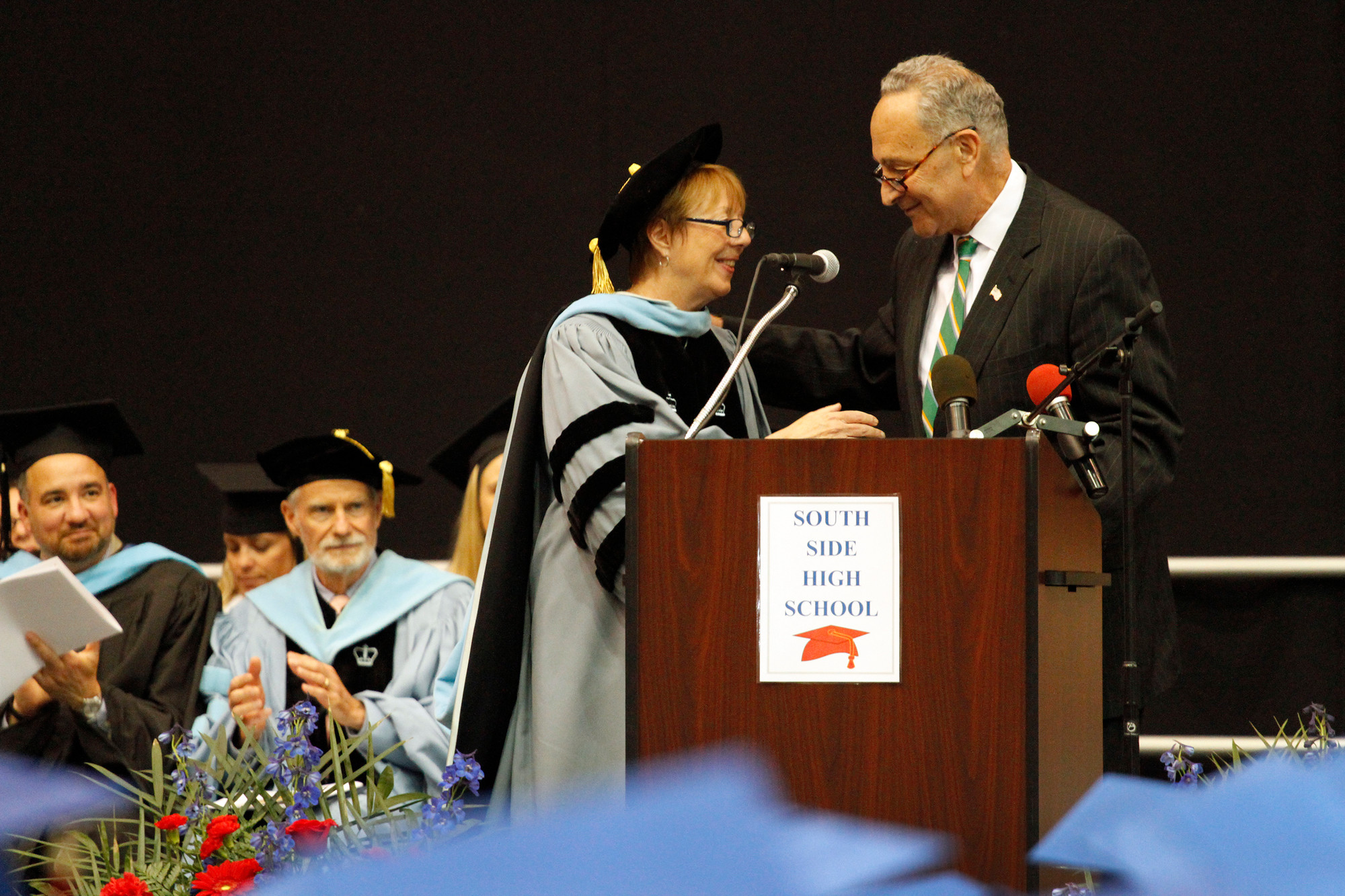 Dr. Carol Burris was thanked for her service at South Side High School by Sen. Charles Schumer at the school’s graduation ceremony last week.