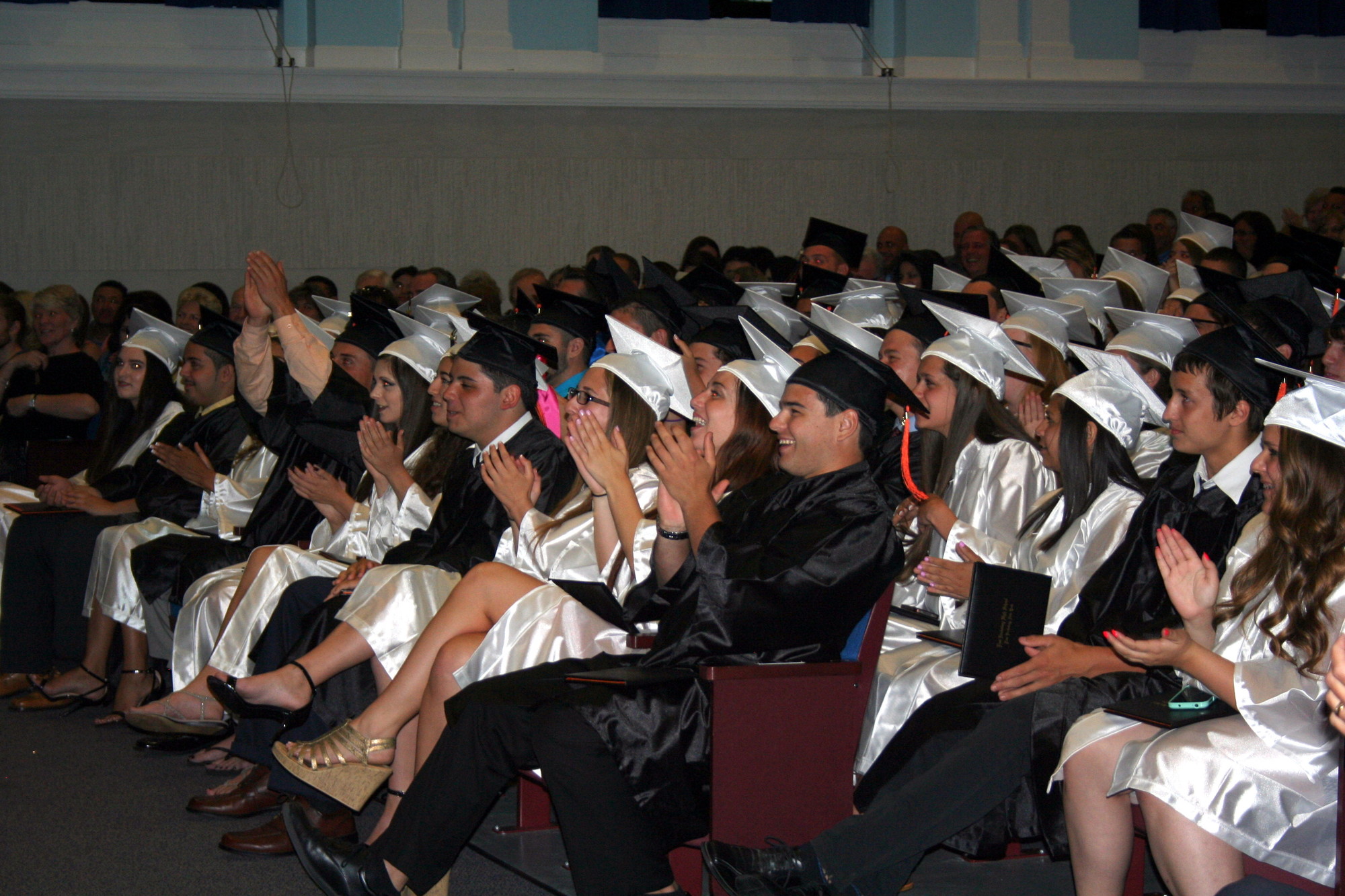 The soon-to-be graduates applauded the speakers at the ceremony.