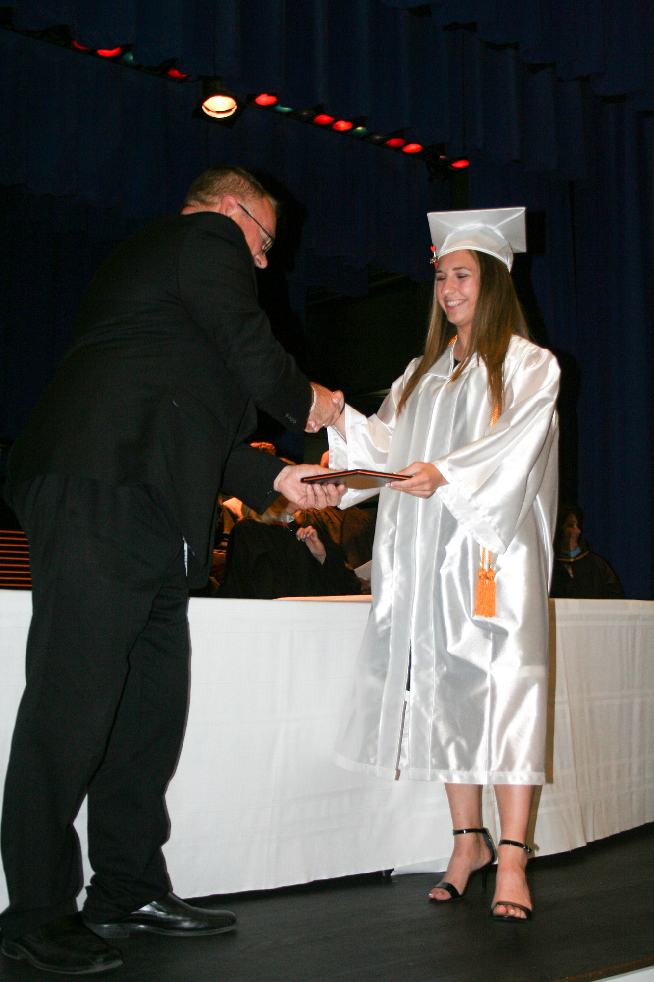Colleen Bennett receives her diploma.