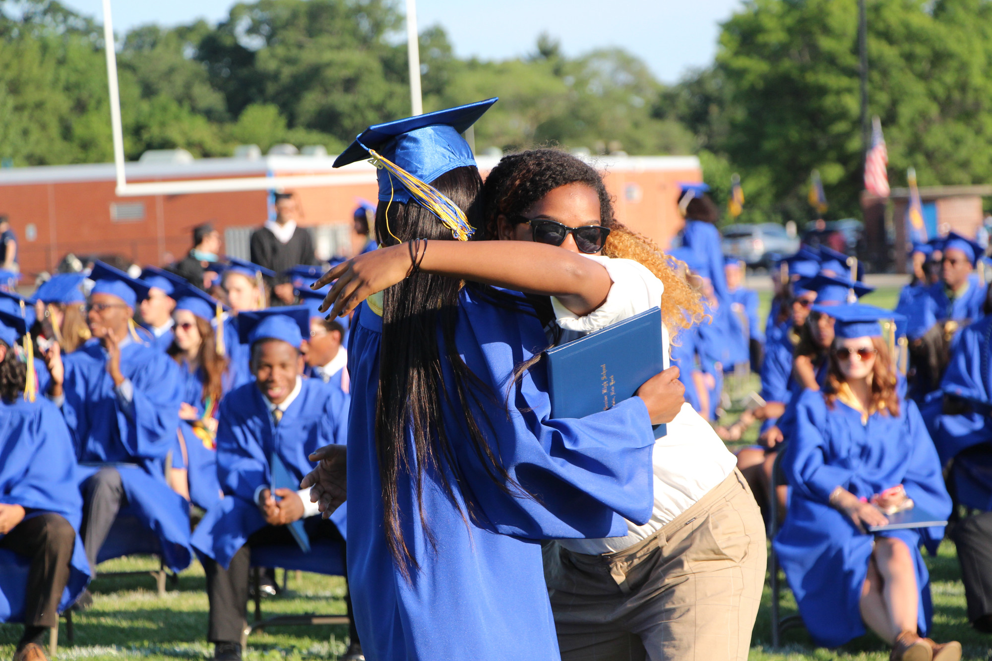 Graduate Maya Robinson embraced  her friend Michaela Barnette.