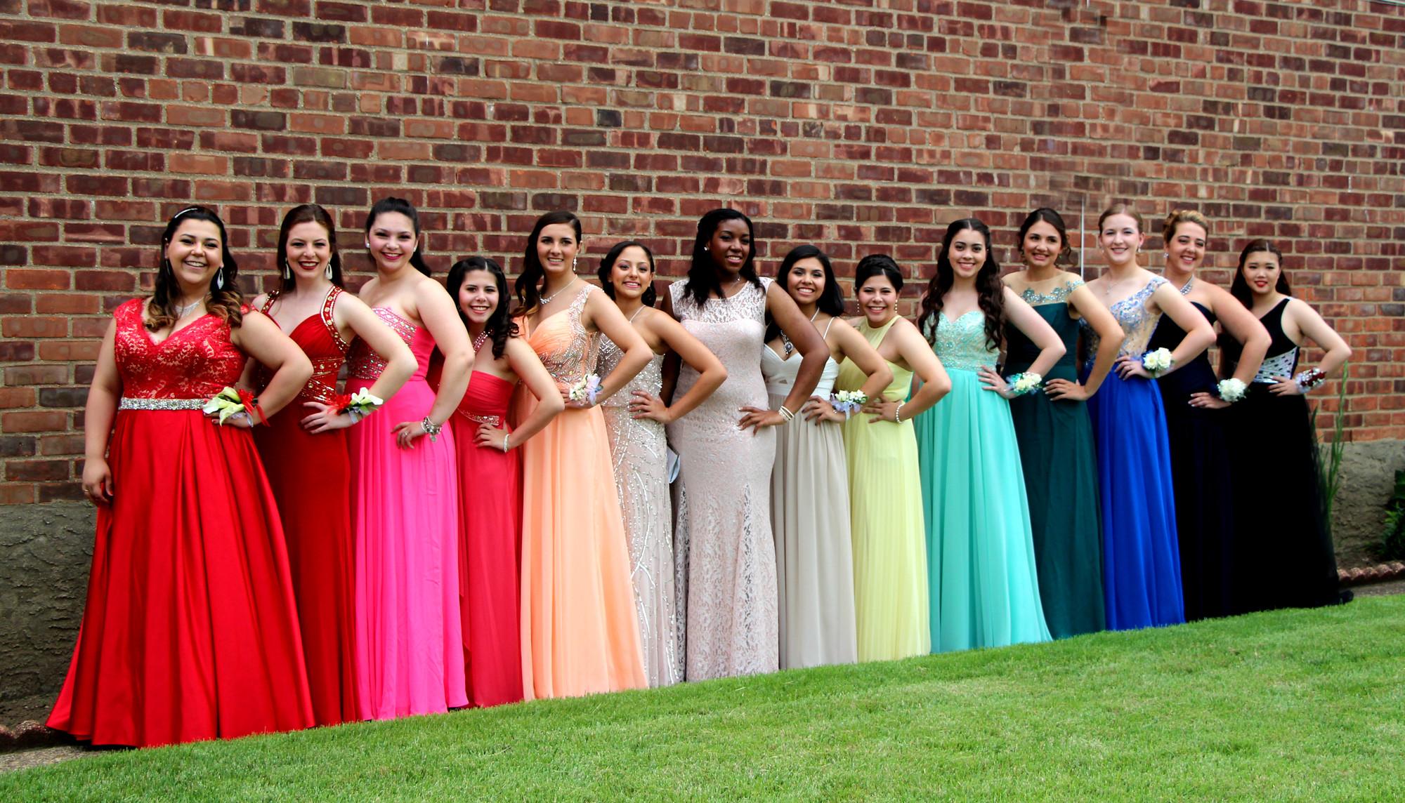 The girls showed off their colorful dresses before prom.
