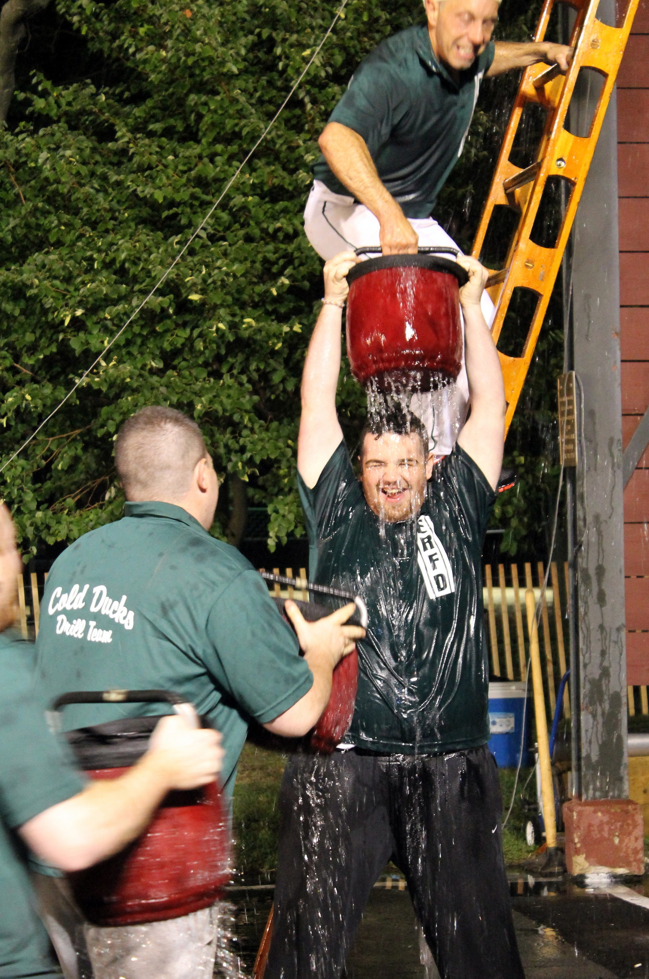 East Rockaway firefighter Sean Mckee got drenched while passing the bucket.