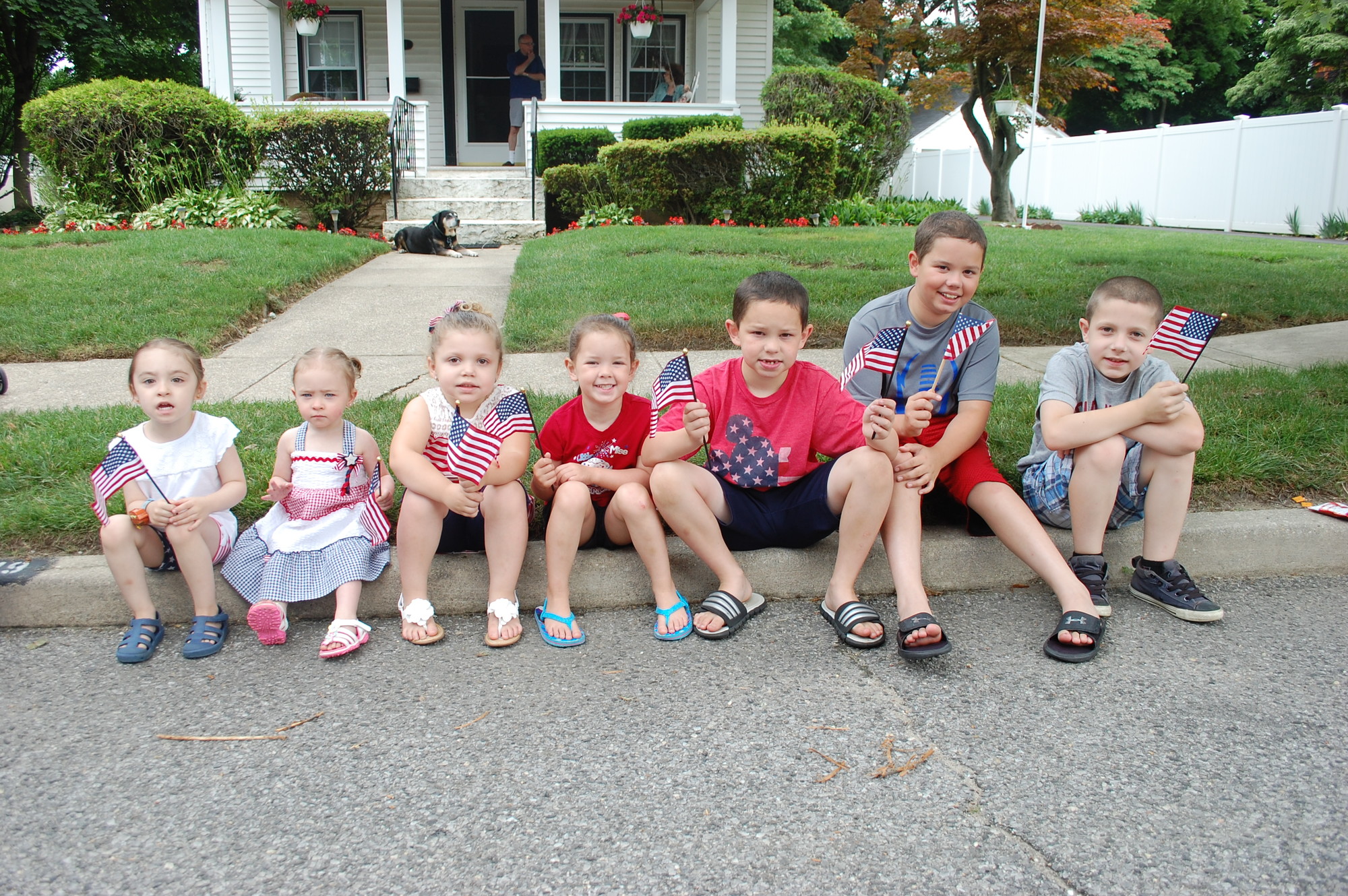 A group of children showed their American pride as they waited on Island Road for the parade to pass by.