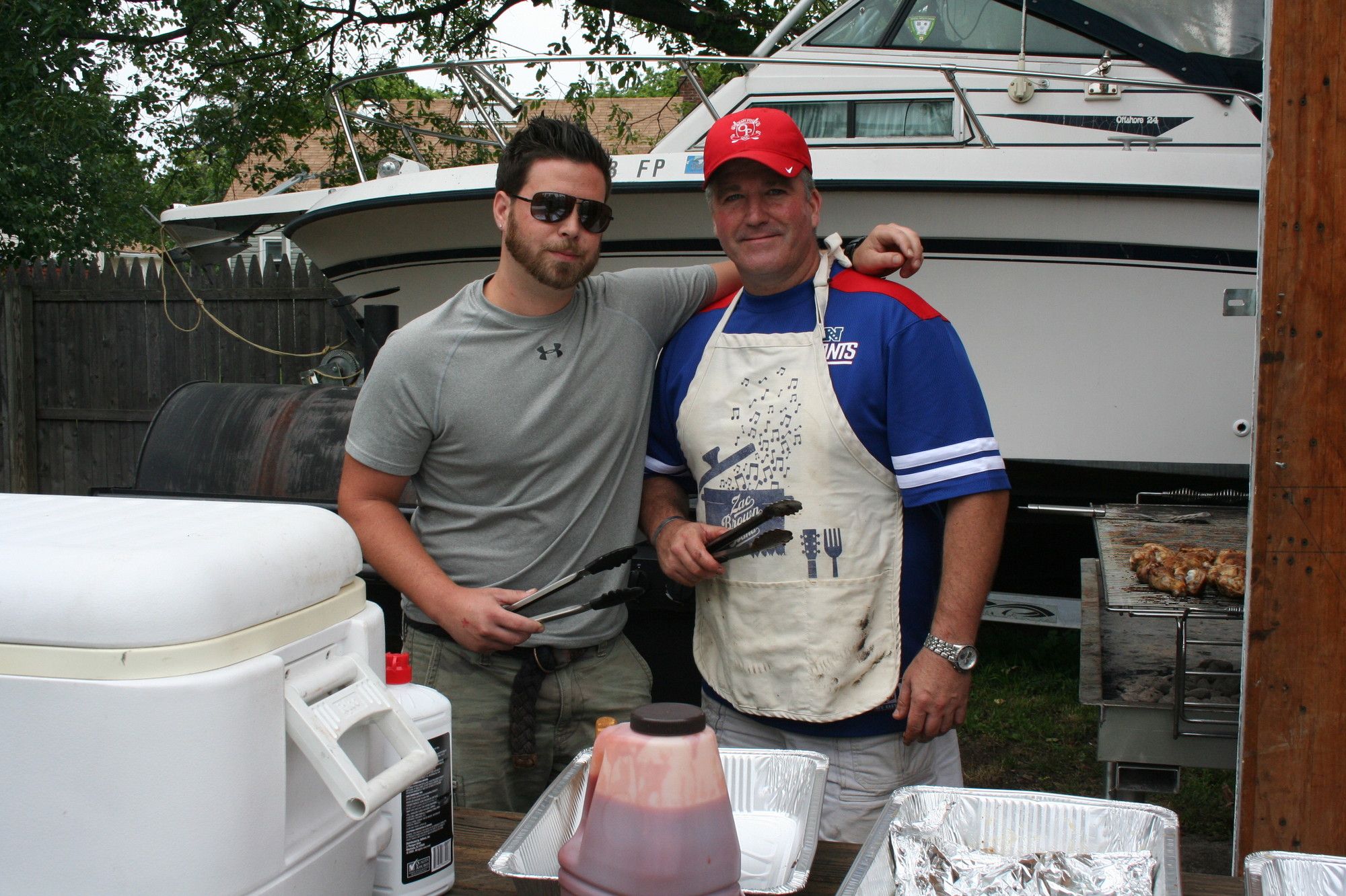 Freddy Berotti Jr. and Owen McHenry fired up some burgers and hot dogs for the barbecue.