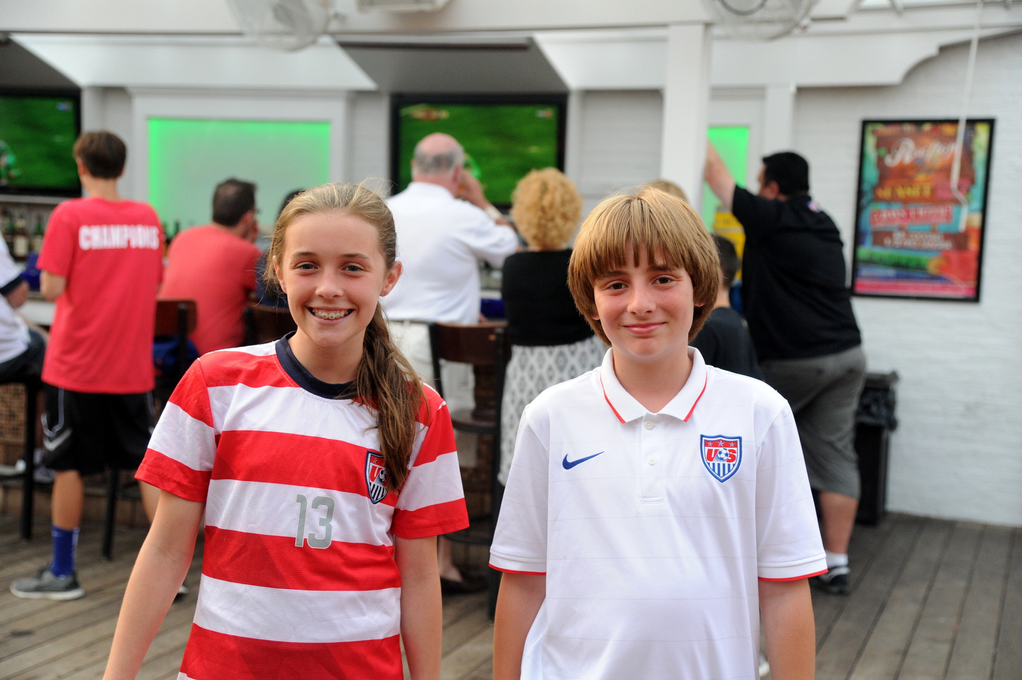 Kate Sweeney and Ryan McNichols, in their Team USA jerseys, came to Kasey’s to watch the game with their friends and family.