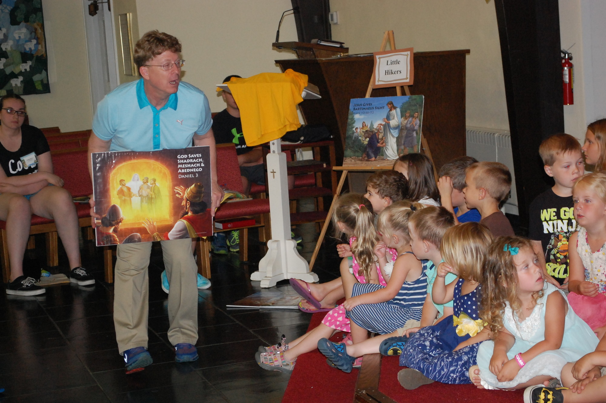 The Rev. Martin Nale went over Bible lessons with the children.