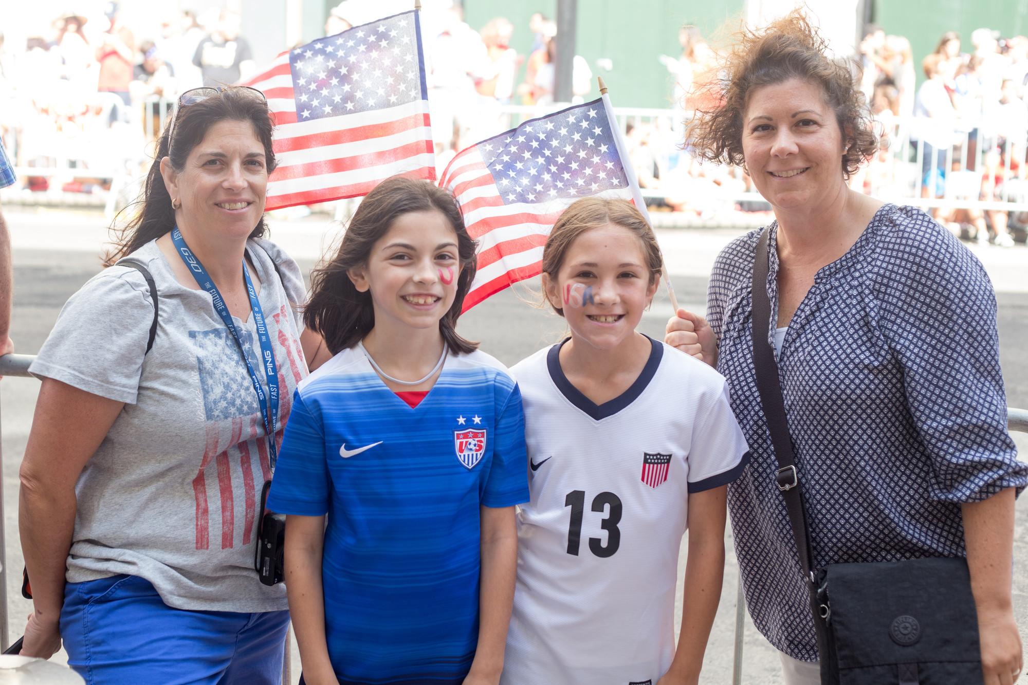 Julie and Marisa Terrone, of Westbury, and Ivan and Oliva Docyk, of Carle Place, didn't miss the opportunity to cheer on American heroes.