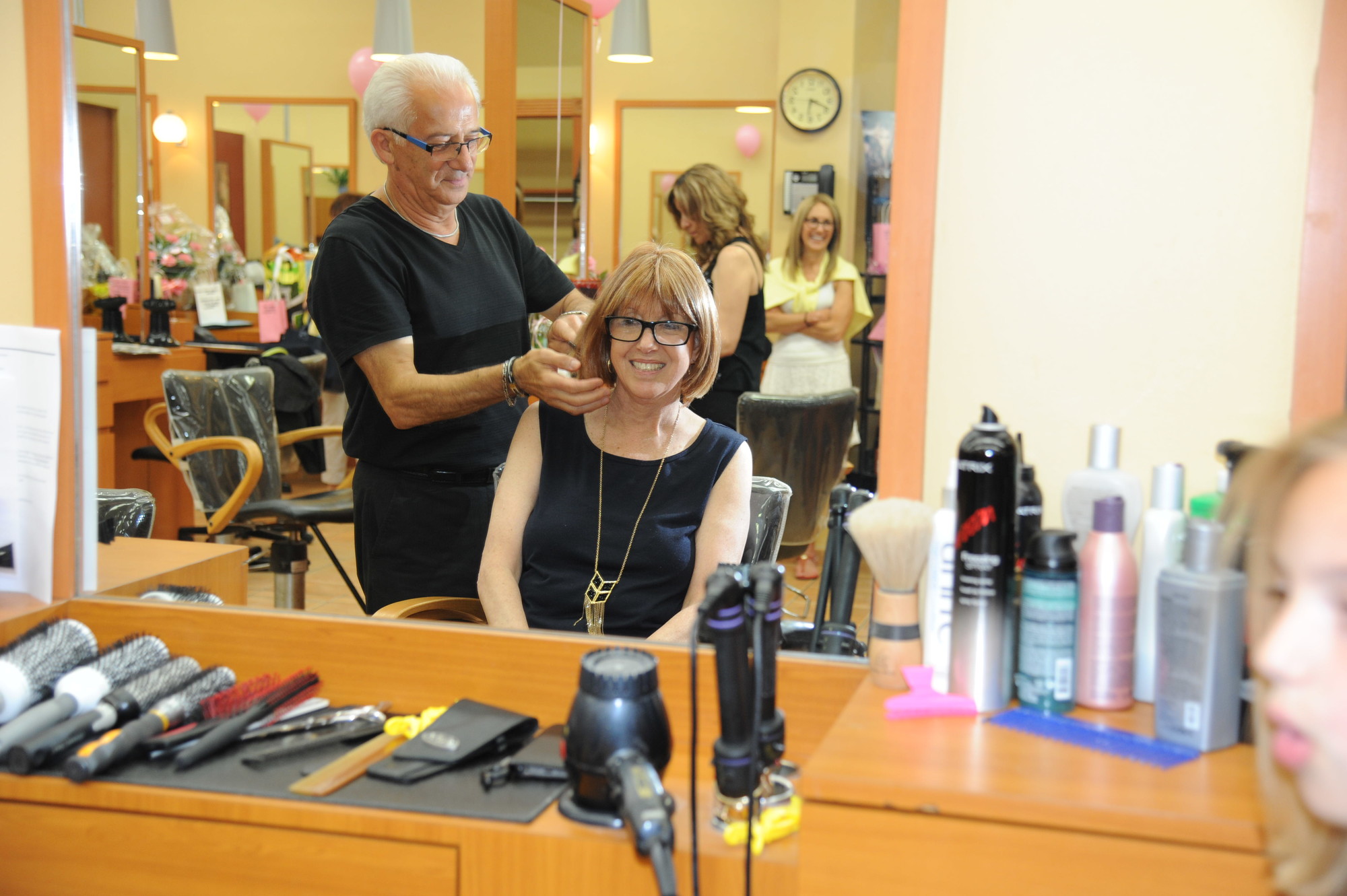 Nancy Schawelson Friedman has her hair styled by Hair Expo owner Mario Gentile.