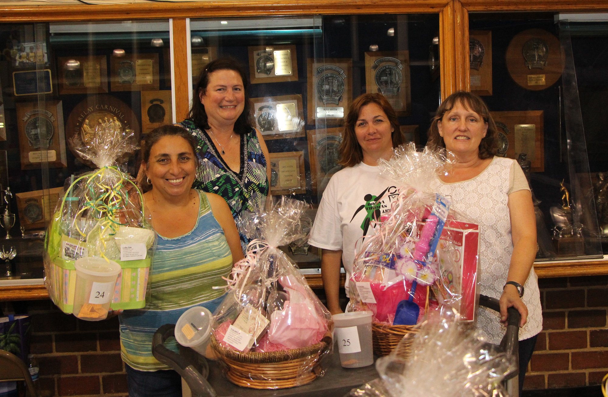 Volunteers sold raffle tickets and concessions during the event, including, from left, Renee Salmon, Lori Murray, Lori Brady and Lynn Maniace.
