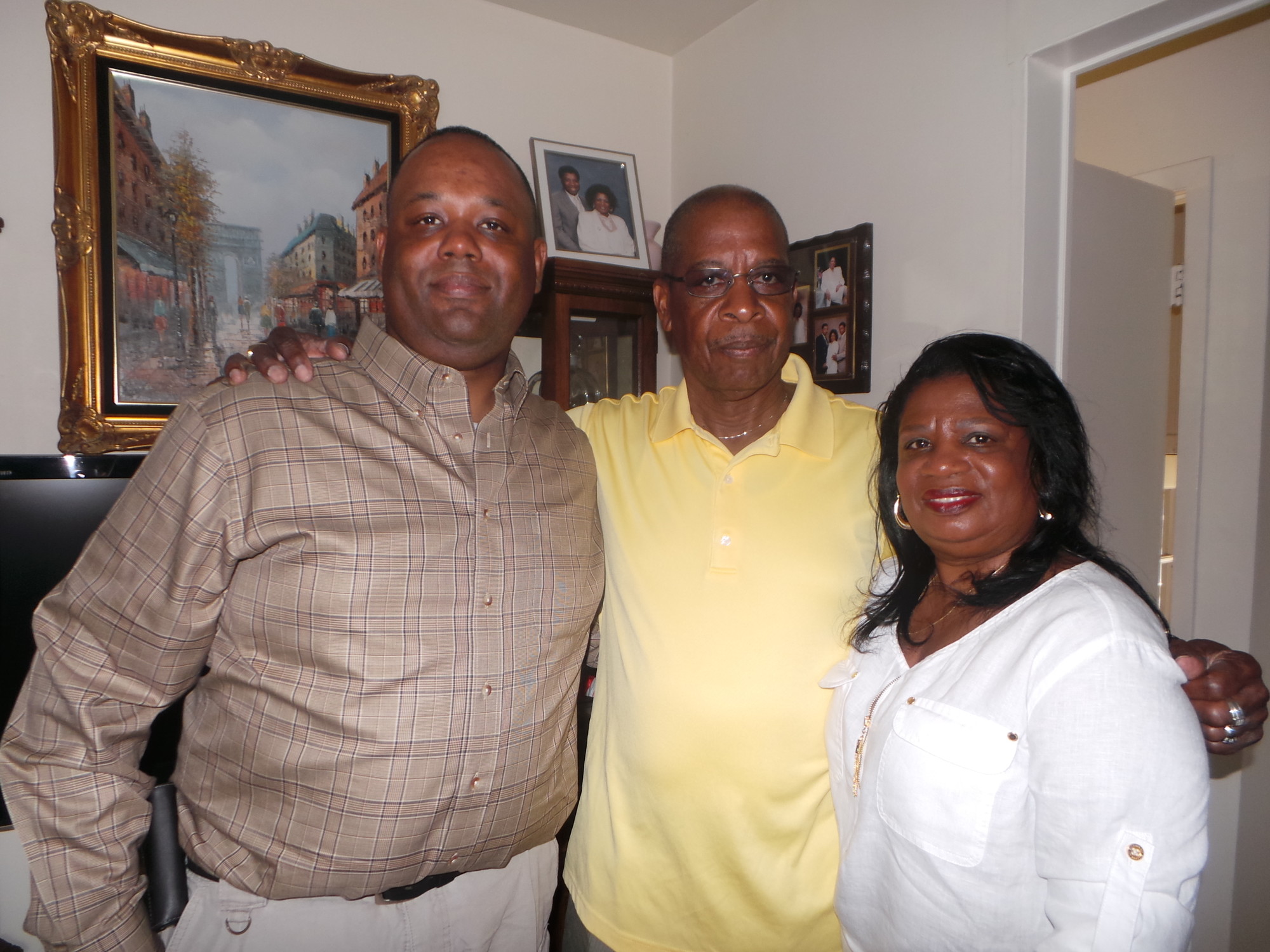 Sgt. Robert Scott III, with his father and mother, Robert Scott Jr. and Valence, in their home on the newly dedicated Sgt. Robert Scott III Boulevard.