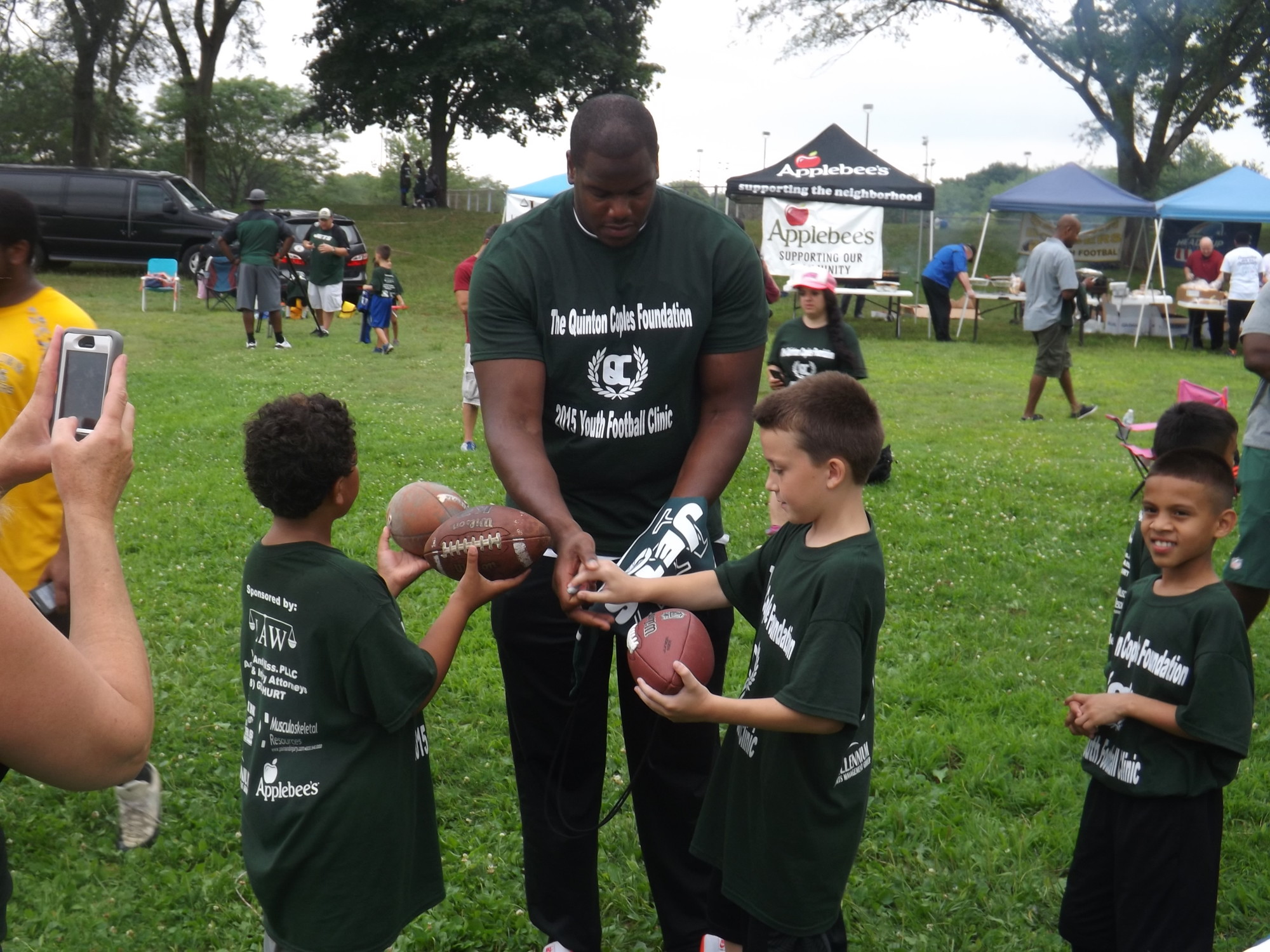 D’Brickashaw Ferguson, a Jets offensive lineman from Freeport, signed dozens of autographs at the event.