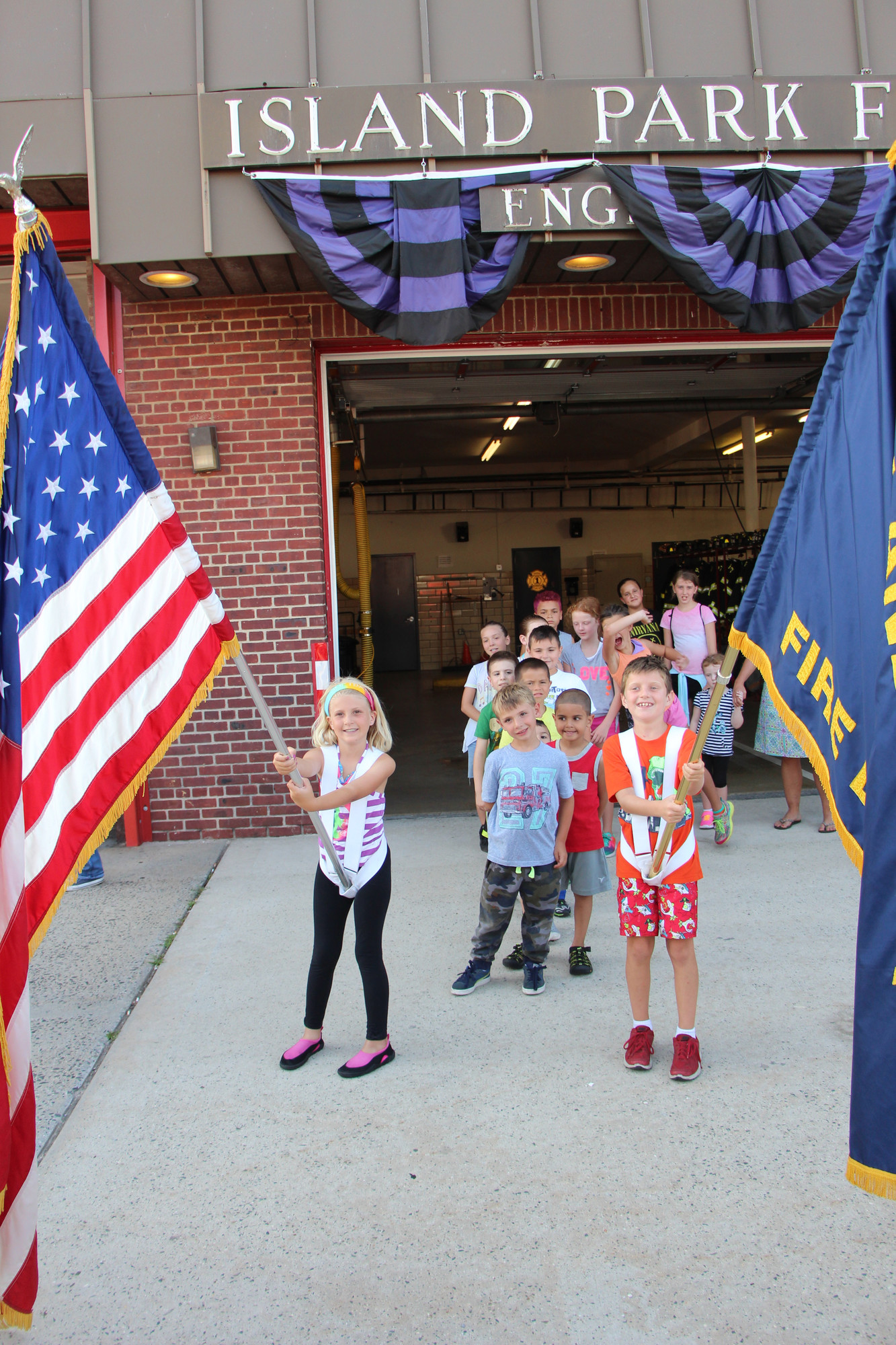Madison Brandt and Matthew Fletcher carried the flags for the IP Jr. Firemen’s Parade