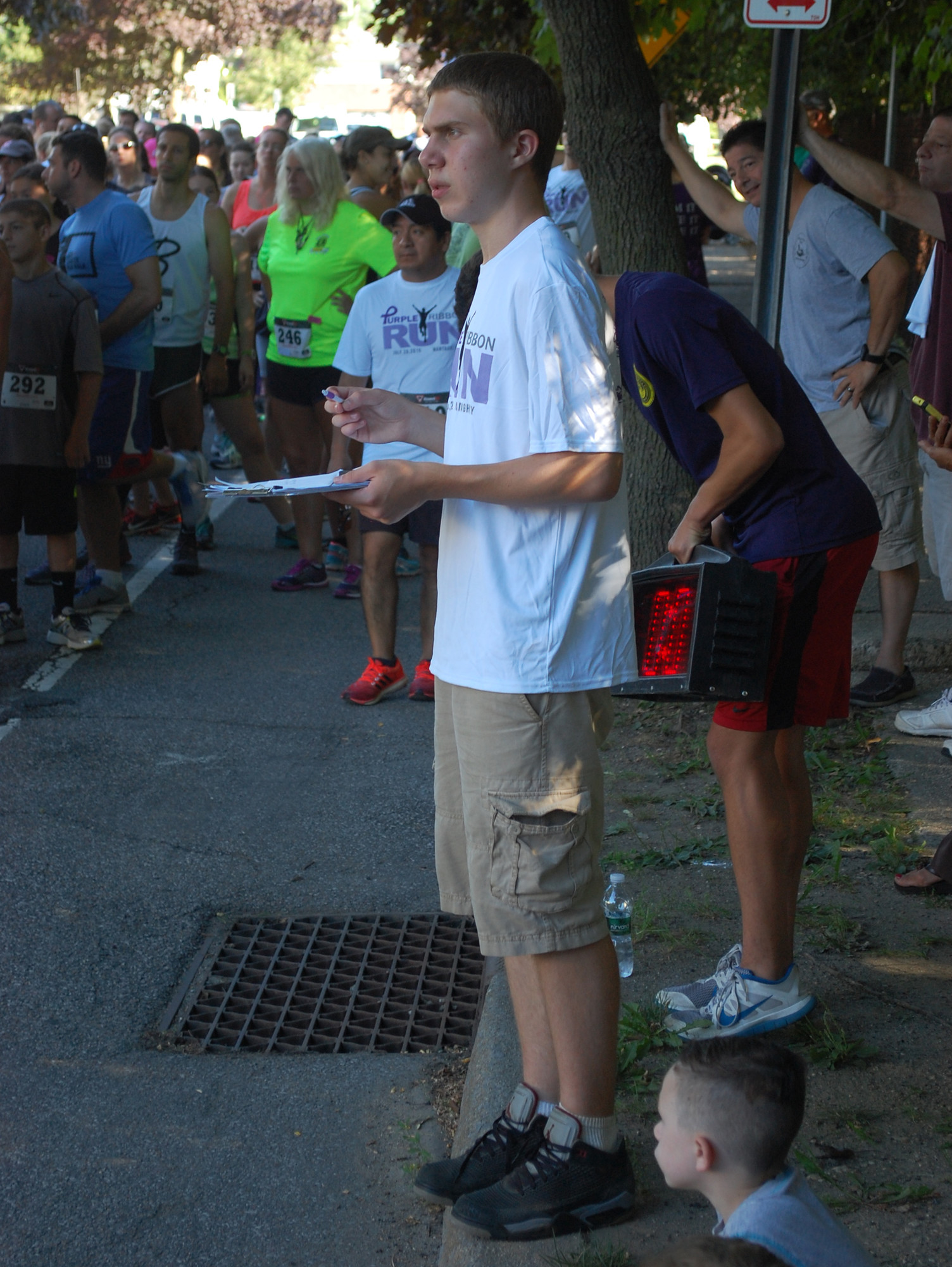 Justin Rockitter, 17, who organized the Purple Ribbon Run in honor of his late grandmother, Susan, kept an eye on the starting line.