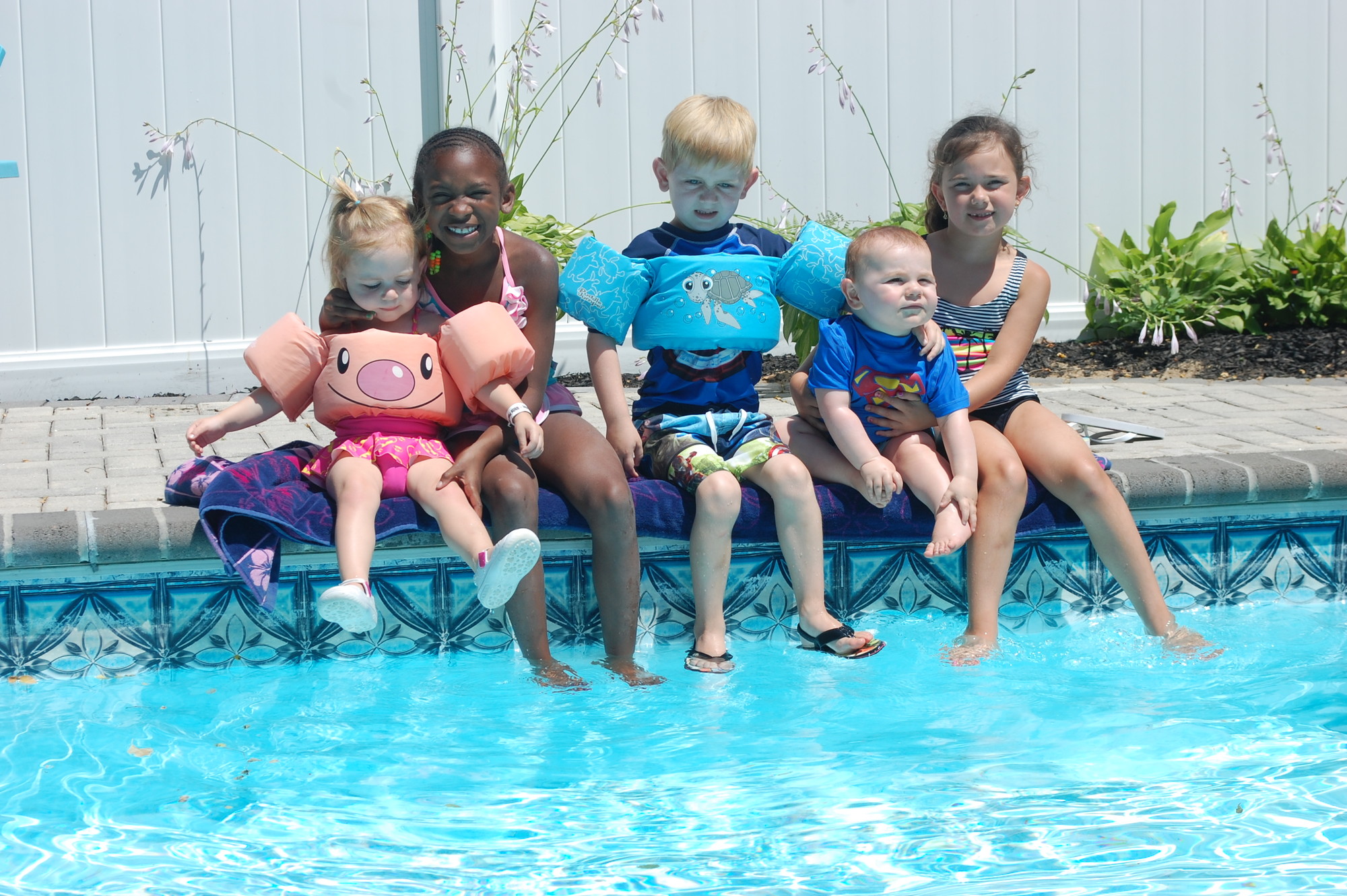 Sade Miller, second from left, has enjoyed the pool during her two summers at Frank and Peggy Marenghi’s house in Seaford. She was joined by their grandchildren, from left, Avery and Brennan Lullo, Lorenzo Suriano and Kailey McKinney.