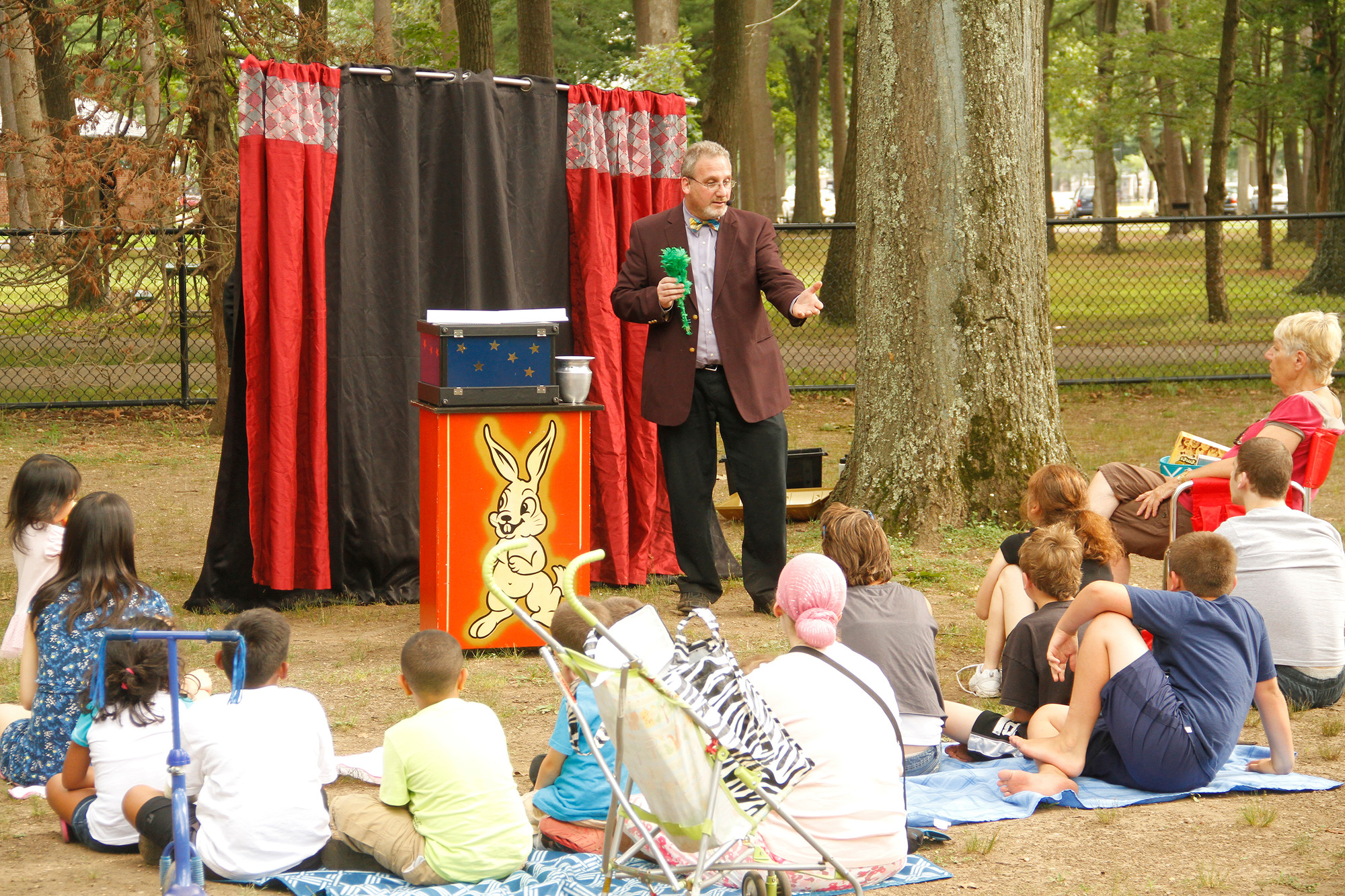 Magician Seth Falley entertained a group of children on July 21 during a free program at the playground.