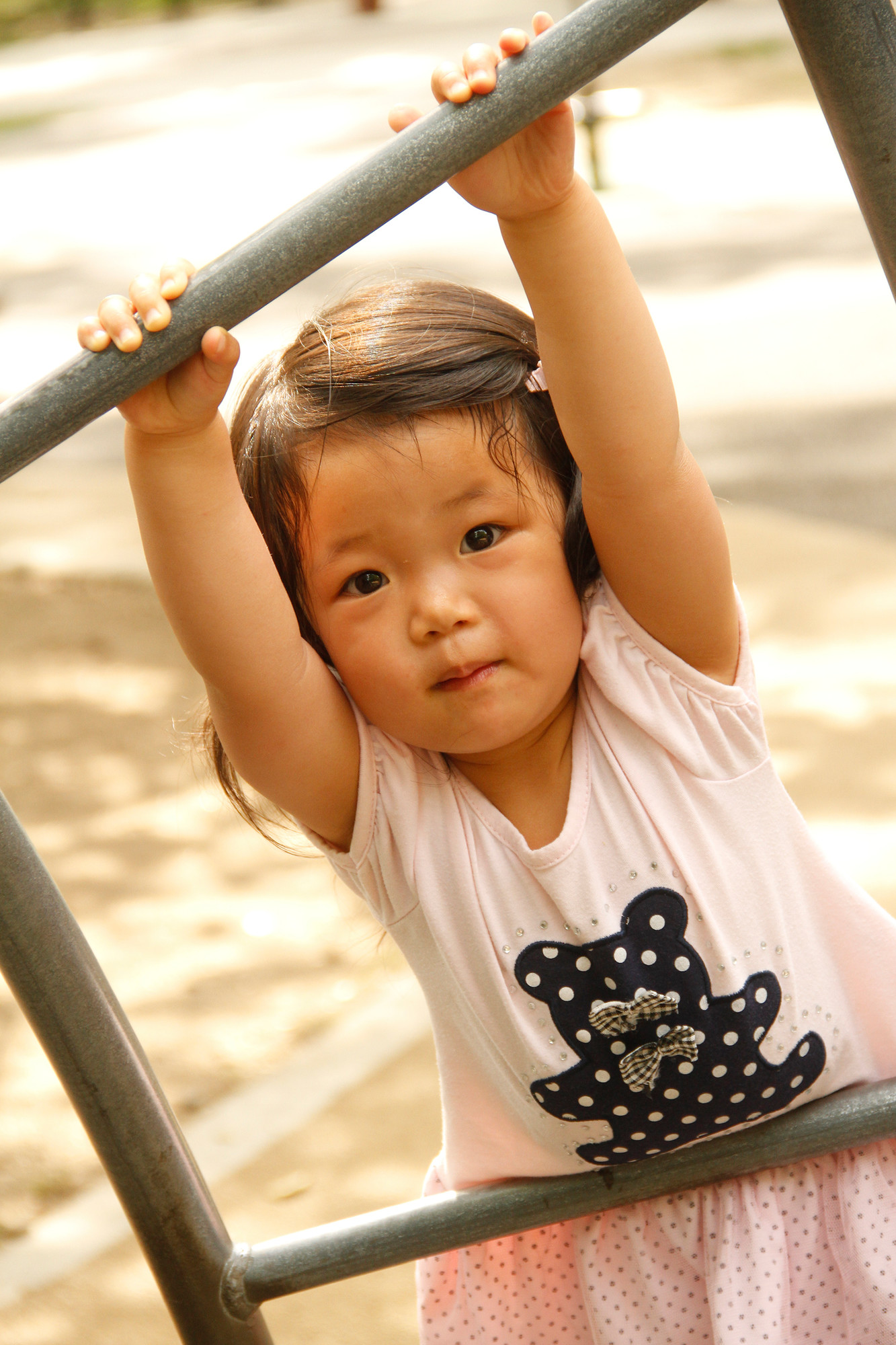 Sienna Tai, 3, is one of many children who has frequented the Let All The  Children Play accessible park and playground in Eisenhower Park this summer.