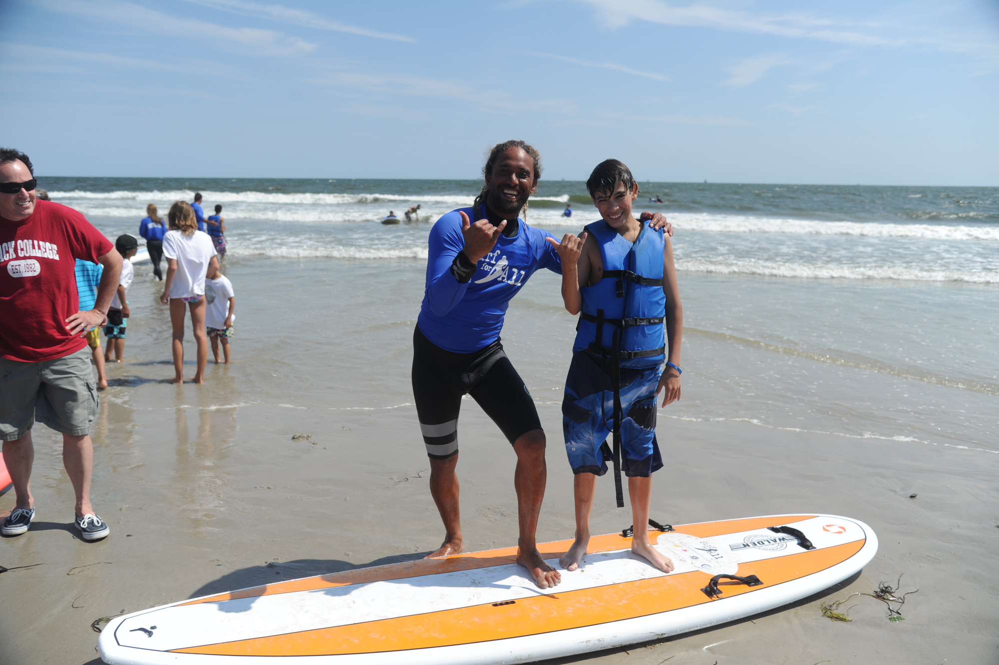 Pro surfer Keallii Mamoala with Nick Reid, 14.