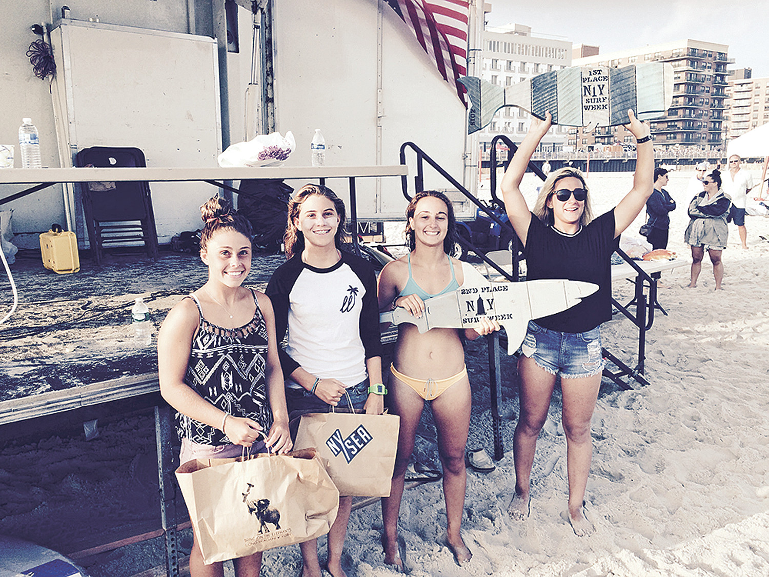 Girls’ surfing contest finalists Summer Ejnes, far left, Dakota Ejnes, Brooke Baldassare and winner Alexa Muss.