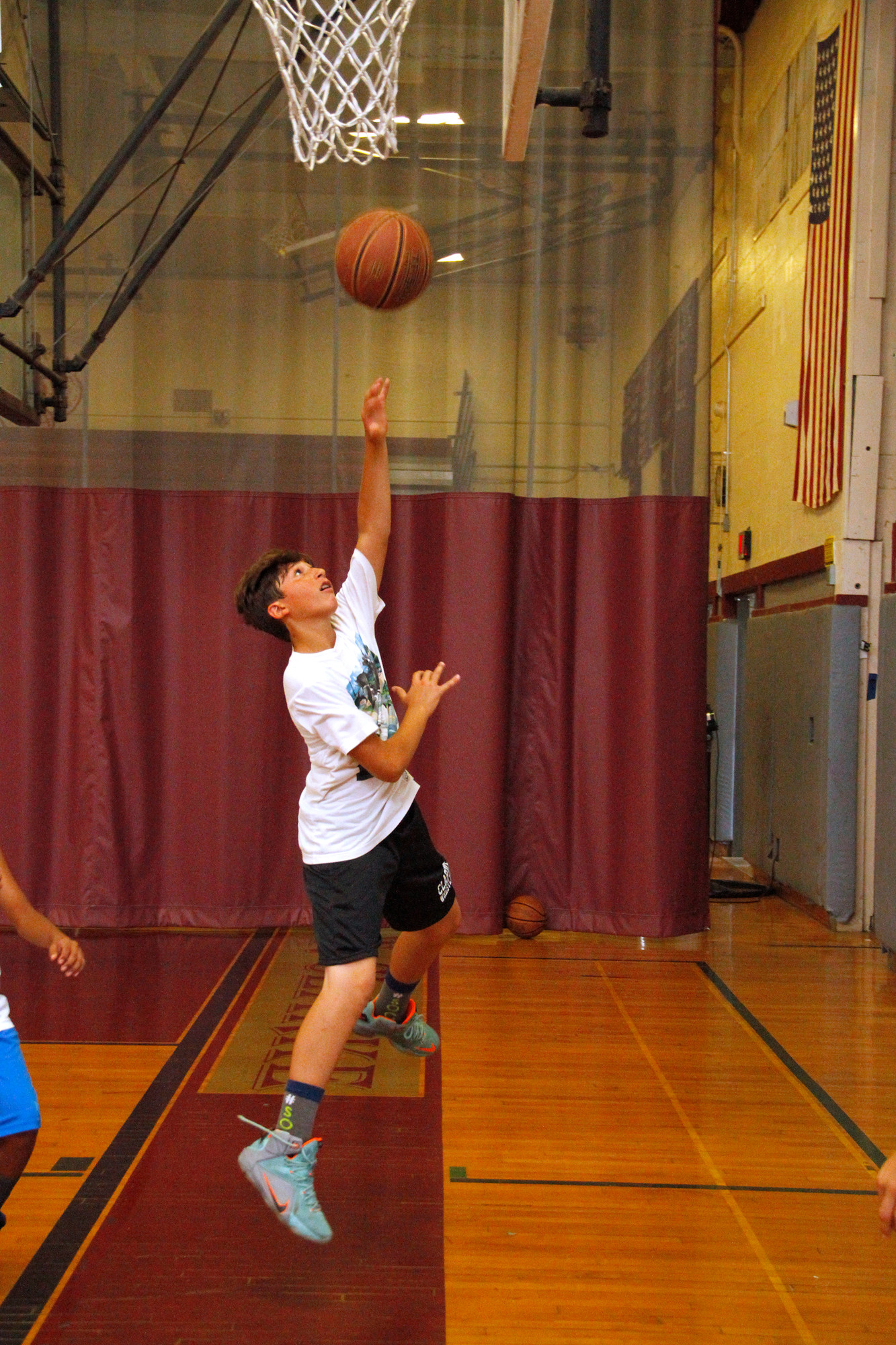Lucas Rubenstein executed a lay-up at W.T. Clarke High School during East Meadow’s CAPE summer sports program last week.