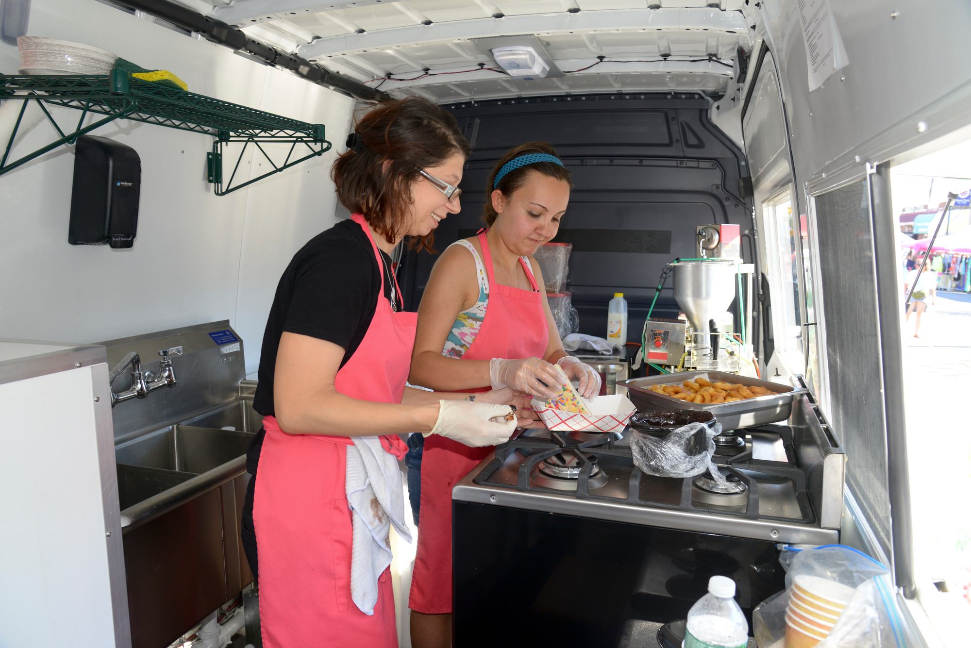 An inside view of the Frozen Sin food truck with Stephanie Lauria and Erica Belk.