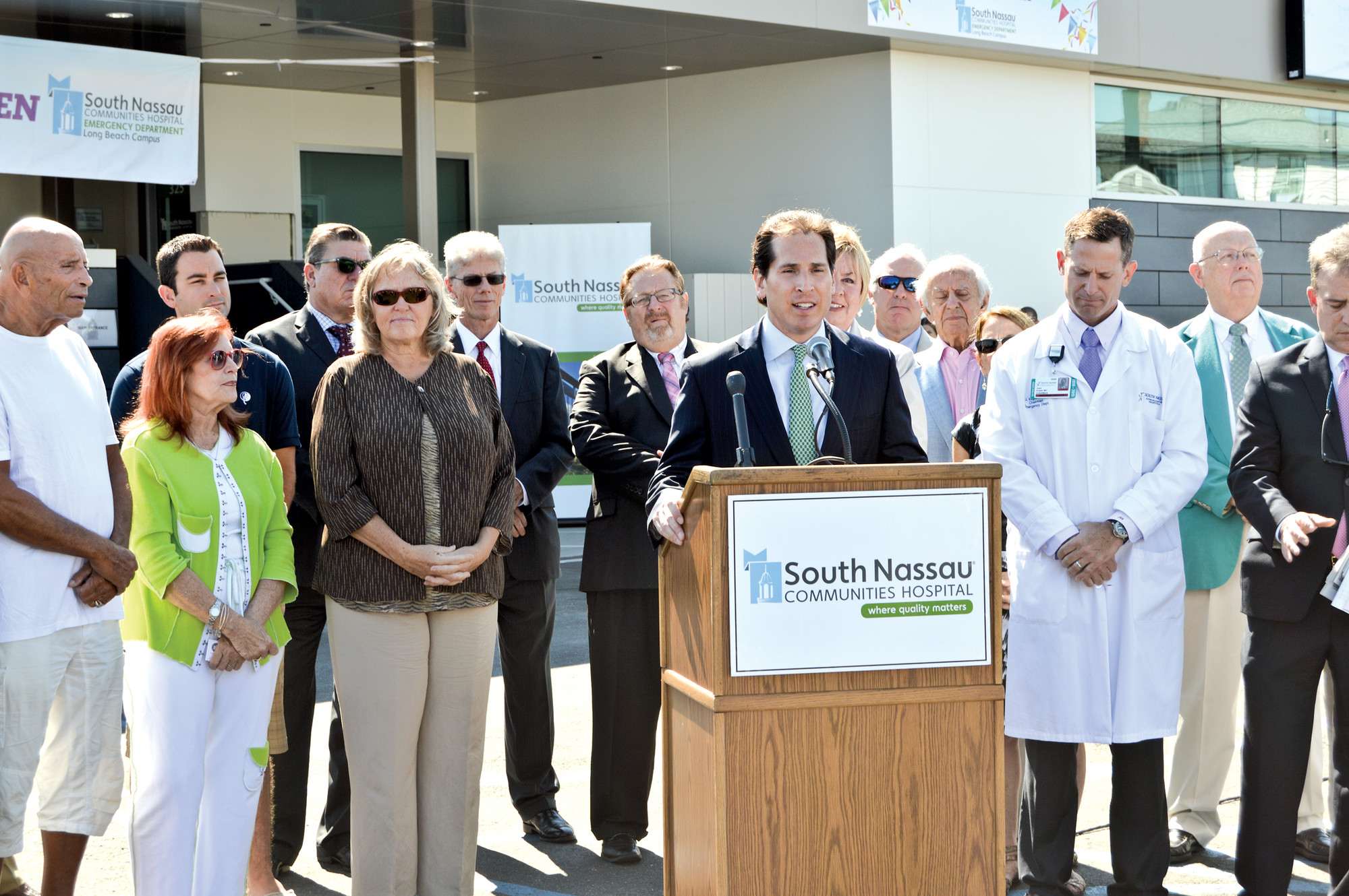 State Assemblyman Todd Kaminsky, at podium, County Legislator Denise Ford, third from left, and other officials spoke at the ribbon-cutting ceremony.