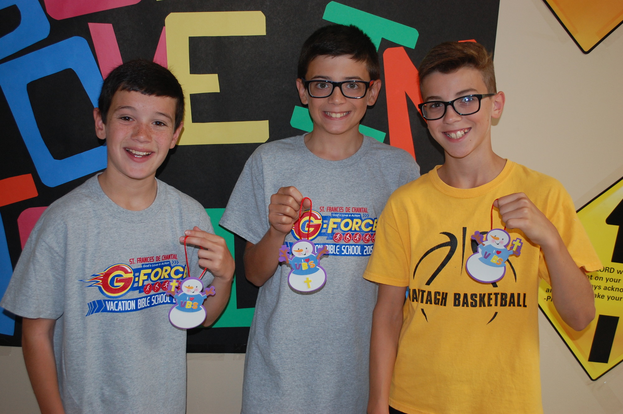 “Bigs” James Lucey, 12, left, Robbie Spiteri, 12, center, and Dylan Reich, 11, all of Wantagh, helped make VBS souvenir ornaments for all of their “littles.”
