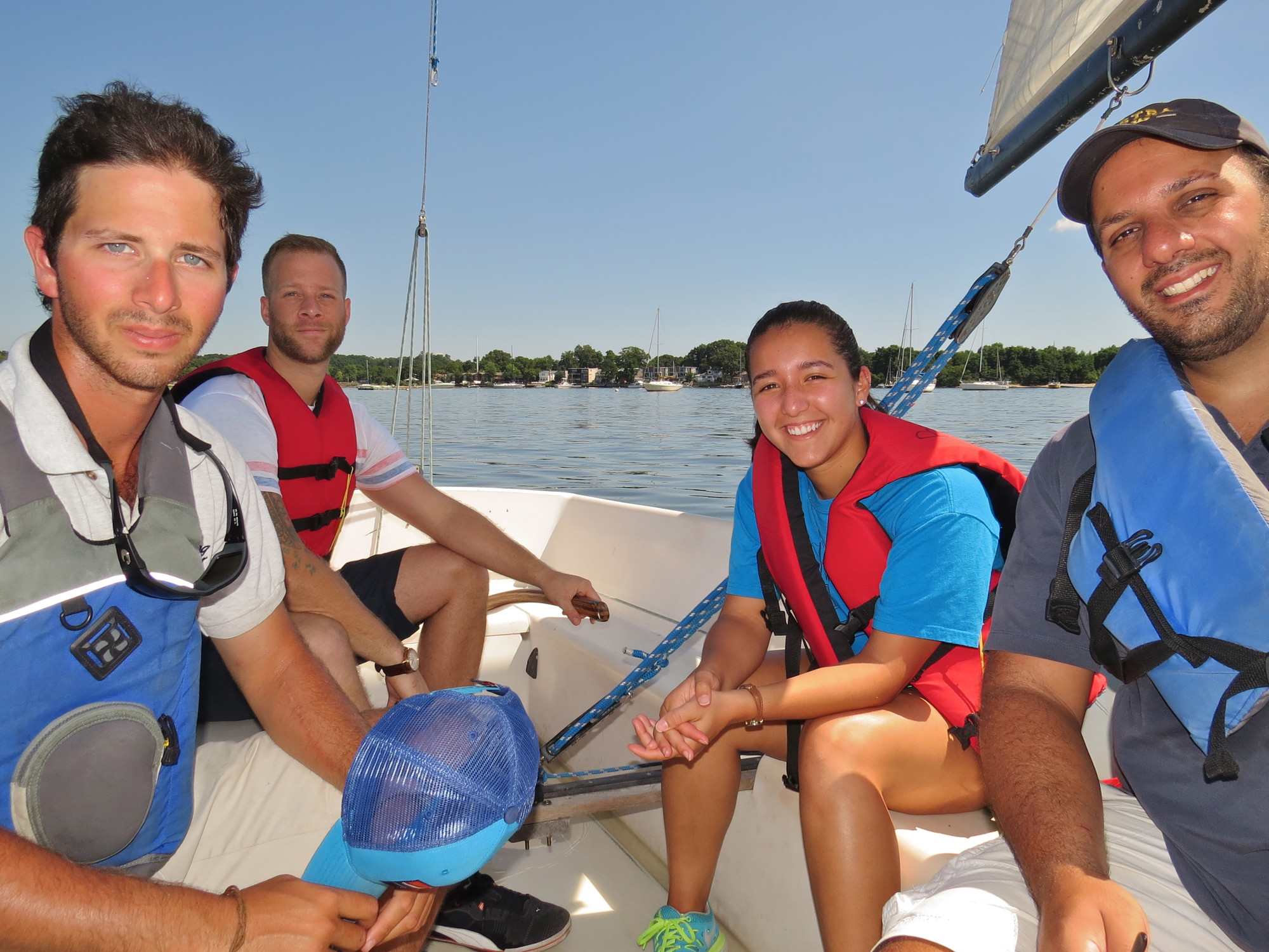 Herald intern Taylor Zambrano with her instructor Eric Wolf, far left, and fellow students Anthony DiMatteo and Jason Thomas, learned the intricacies of sailing in Port Washington.