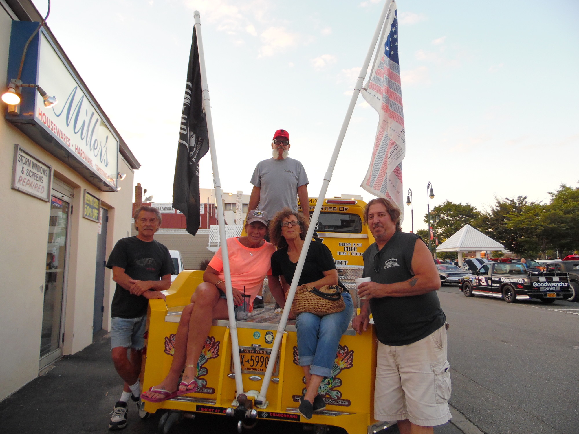 In honor of the Wounded Warriors Project, this 1954 Ford was designed patriotically. Pictured were, from left, David Needham, Kathleen Ruggierio, Bobbi Needham, Michael Ruggierio and, standing, “Theo Kojak.”