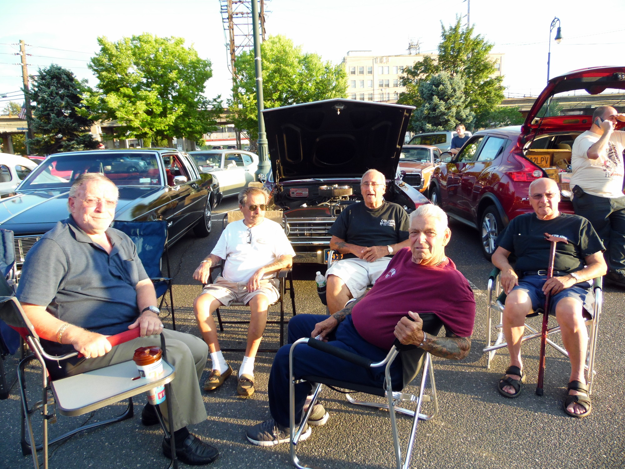 Members of the South Side Boys enjoyed the car show and the company while seated in front of Joe Fish’s 1967 Chevy. Pictured from left were Mario DiMaria, Anthony Ristua, Joe Fish, Nino Spataro, and Joe Tattoo.