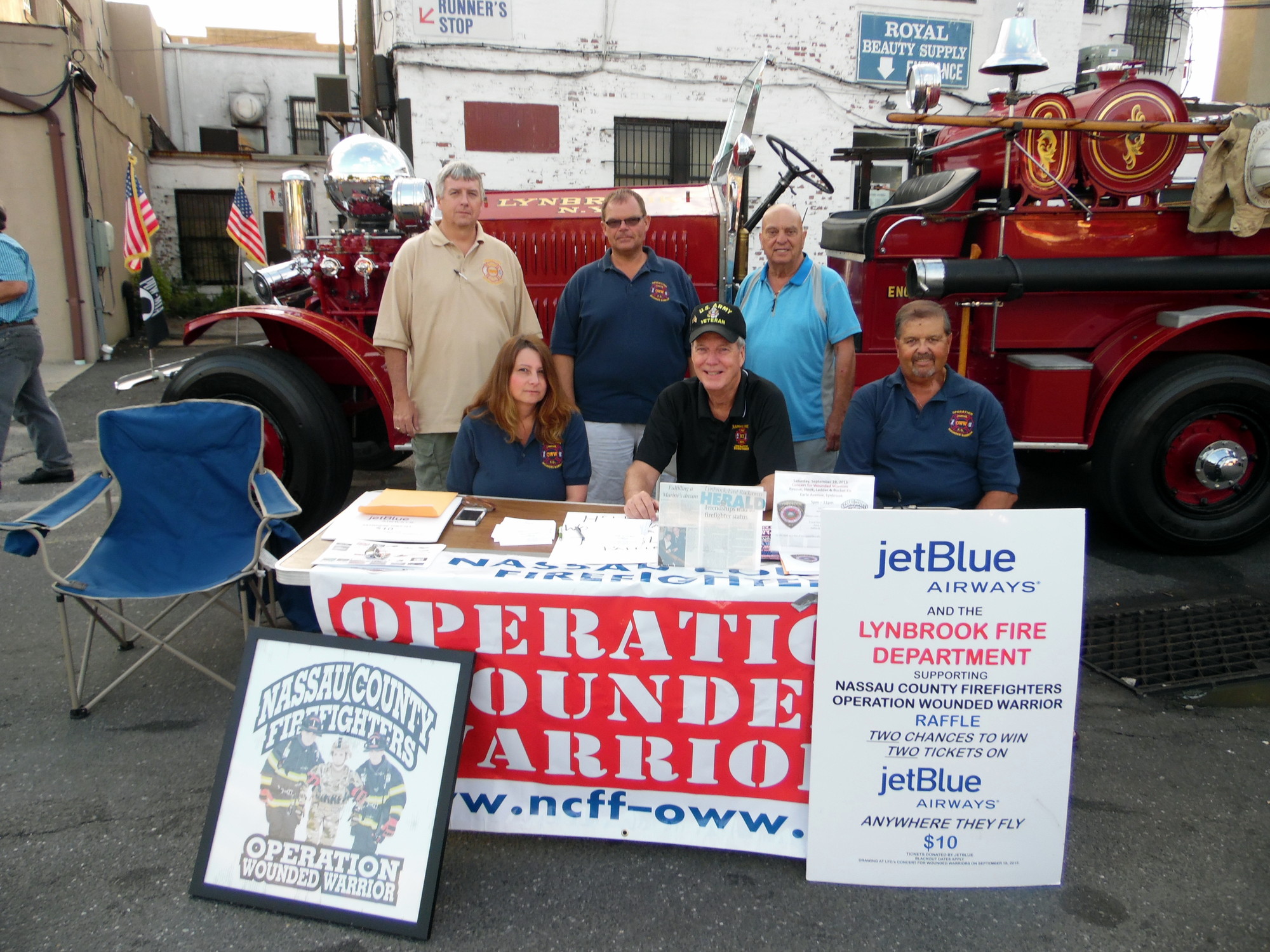Members of the Lynbrook Fire Department manned the table to raise funds for the Nassau County Firefighters Operation Wounded Warrior. Pictured seated from left were Lynne Donnelly, Steve Grogan and Rich Straub. Standing from left were John O’Reilly, Kevin Bien and Tony Badalato.