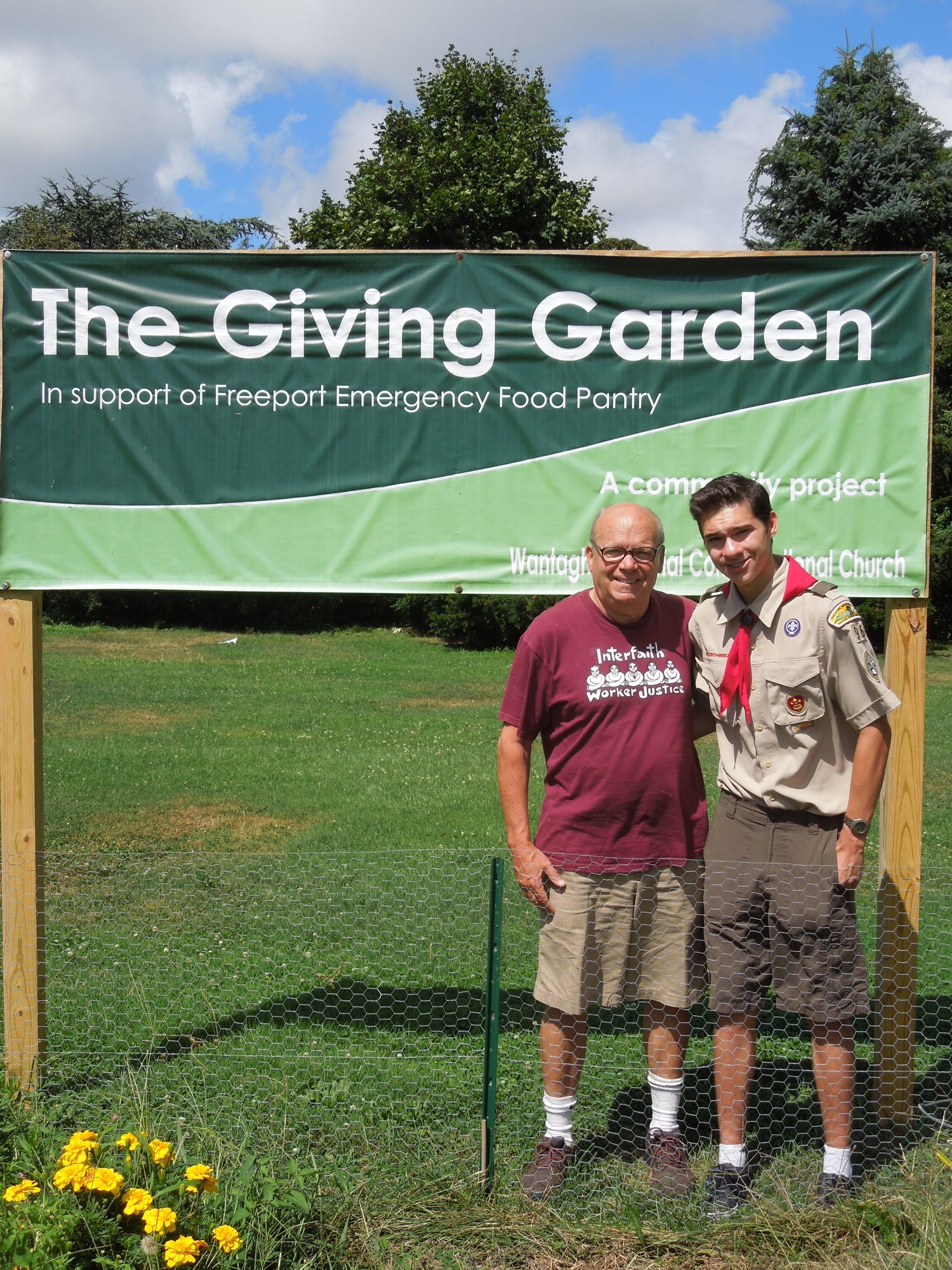 The Rev. Ron Garner, pastor of the Wantagh Memorial Congregational Church, and Troop 96 Boy Scout Brian Howe at the Giving Garden.
