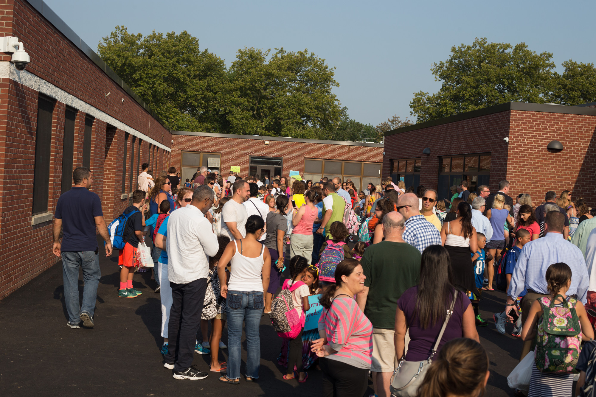 Parents and students milled about outside the new Watson expansion on Monday before school began.