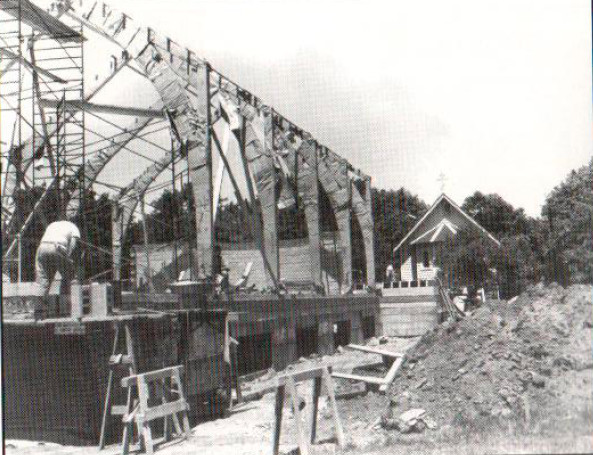 Construction the Holy Trinity’s current building, at 369 Green Ave., in the summer of 1962. Its original building, seen in the background, was damaged in a lightning storm and eventually torn down.