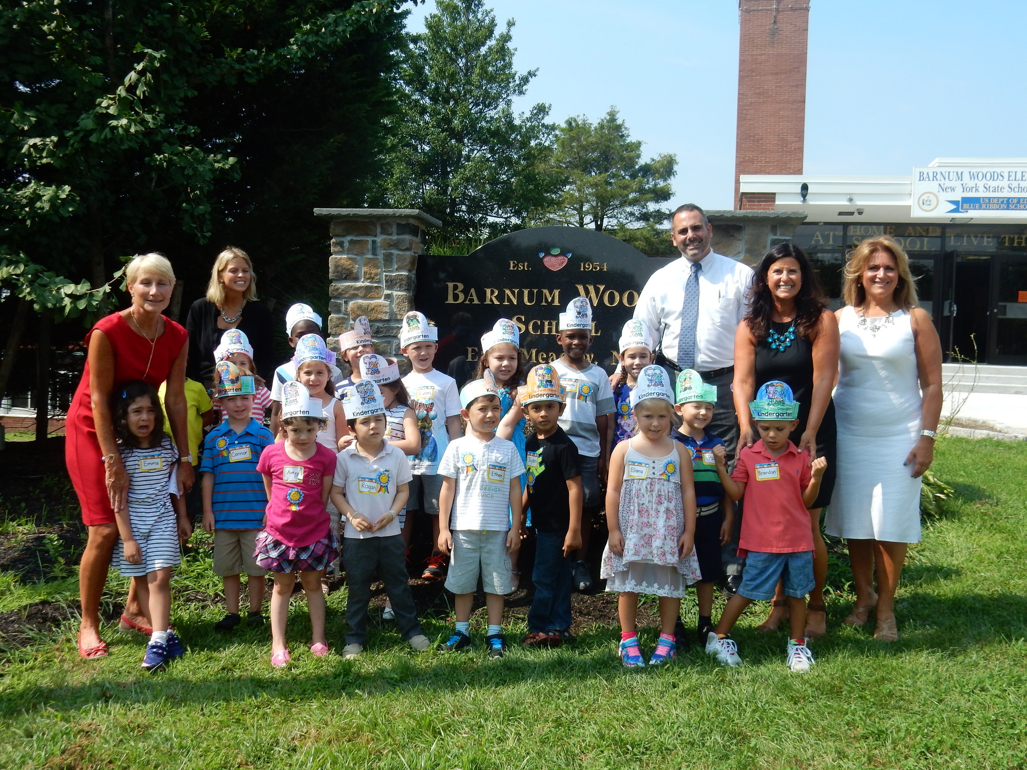 Patty Kelleher’s kindergarten class, with teachers and administrators at Barnum Woods Elementary School were excited (well, almost of them) to begin their first day of school.