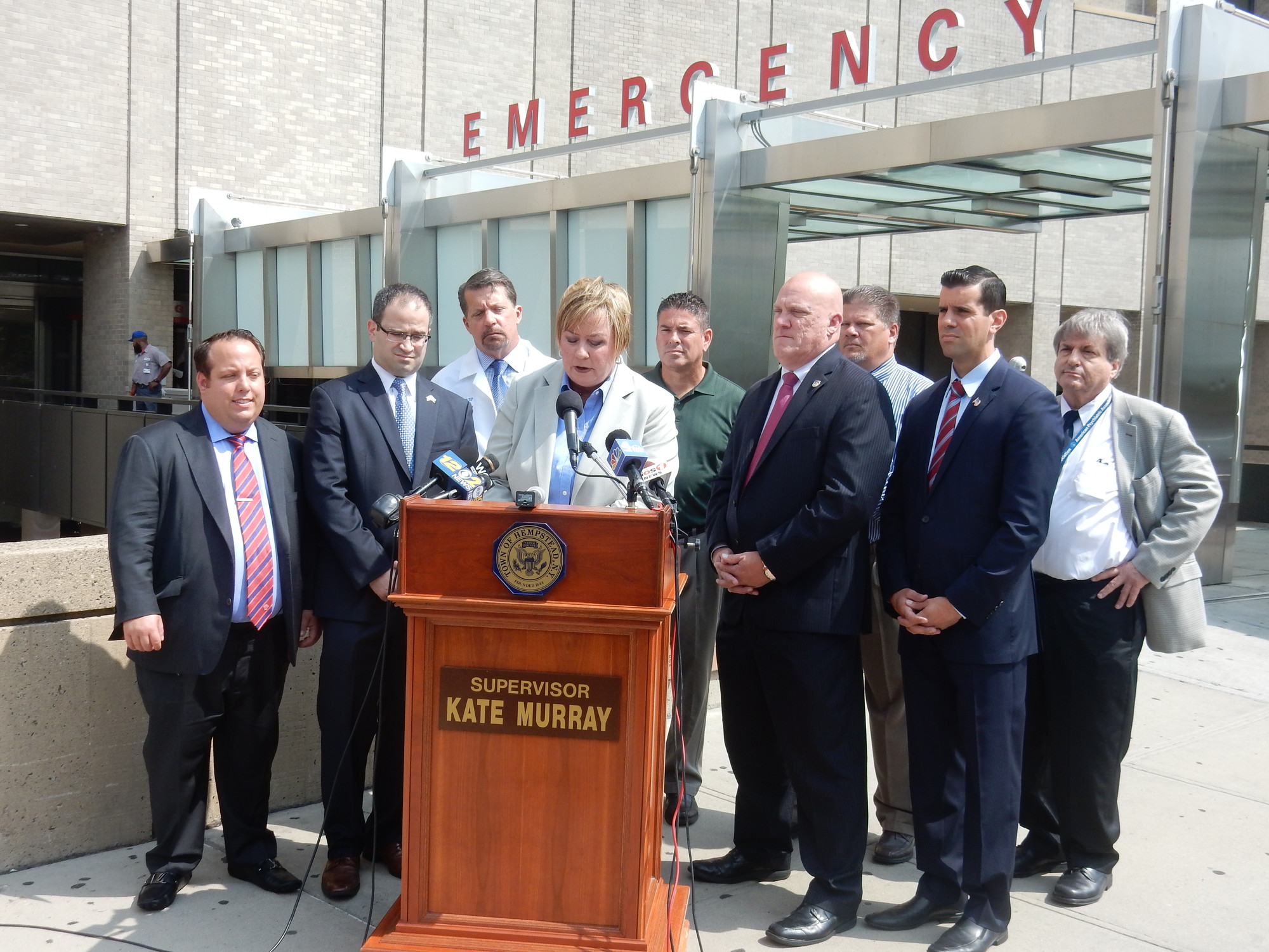 Town of Hempstead Supervisor Kate Murray, with State Sen. Michael Venditto, second from right, and Assemblyman Ed Ra, second from left, and other health and local officials outside the Nassau University Medical Center on Aug. 25.