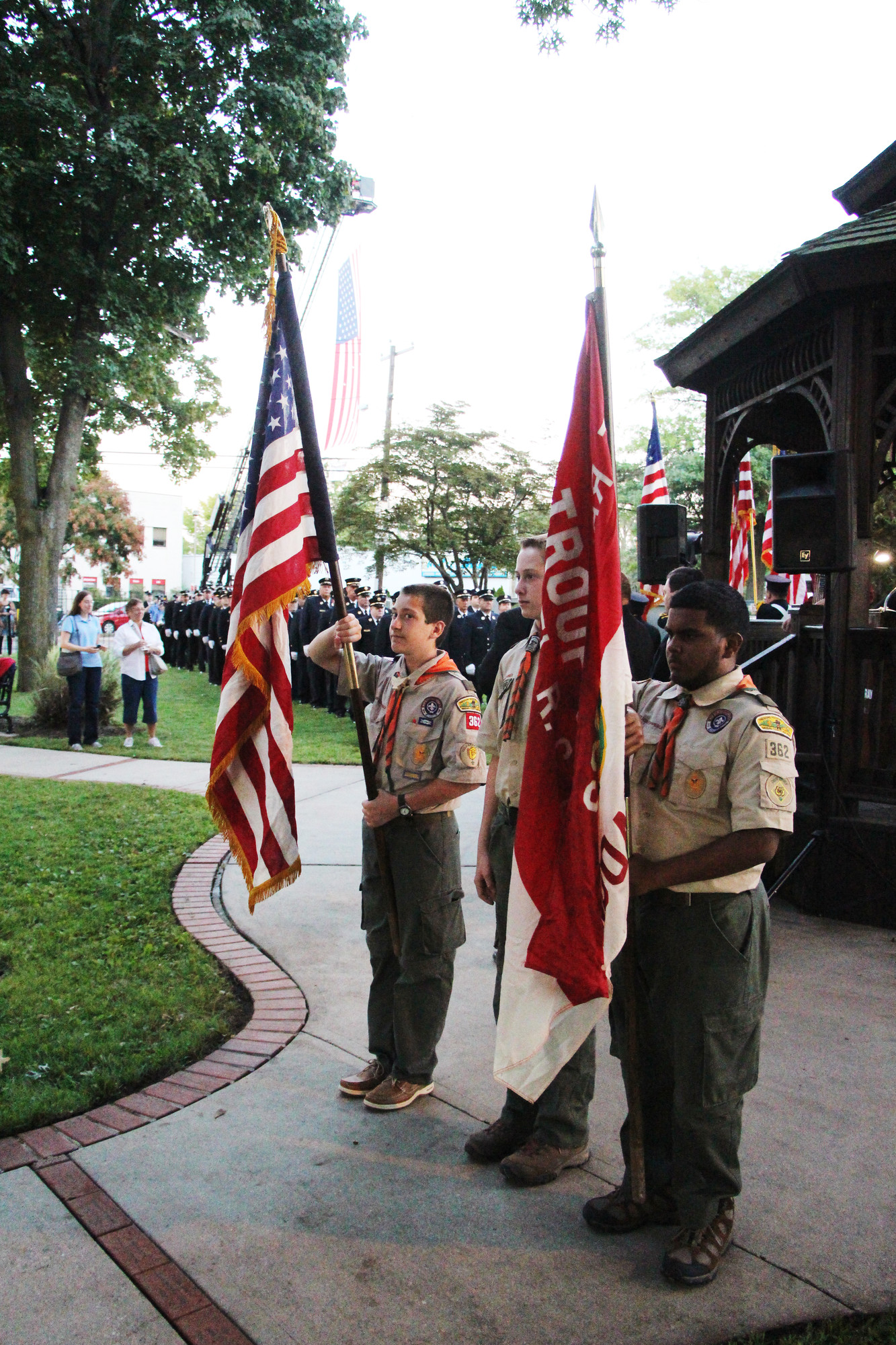 Boy Scouts James Ferrone, far left, Jack Doughtry and Justin Randall, all 15, presented the colors.