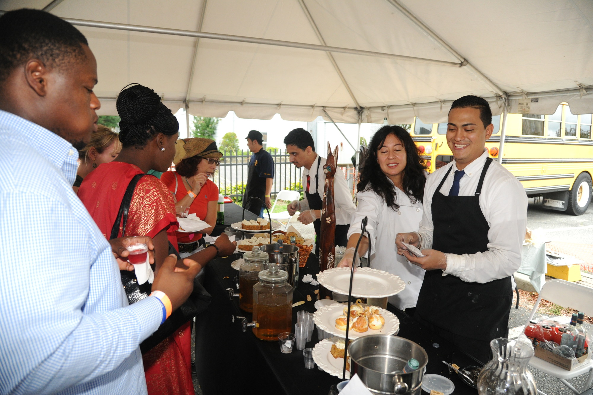 Christian Pozuelos, left, Emma Tso and Eduardo Martinez of Chat Noir served guests their pastries and teas.
