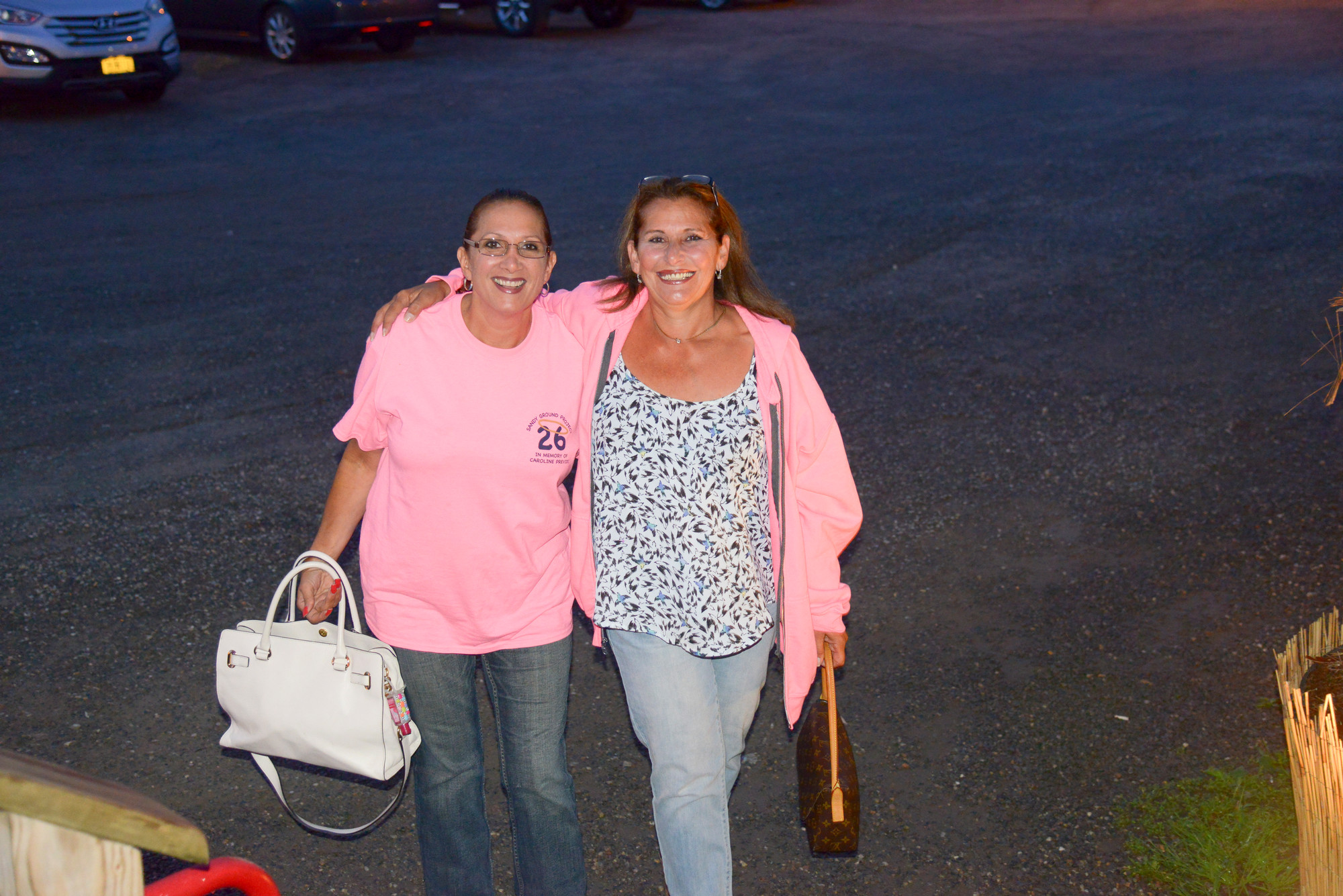 Marianne DeMarco and PattyAnne Conte bring on the pink. T-shirts, raffles and 50-50 were all part of the fundraising effort to benefit The Sandy Ground Project: Where Angel’s Play.