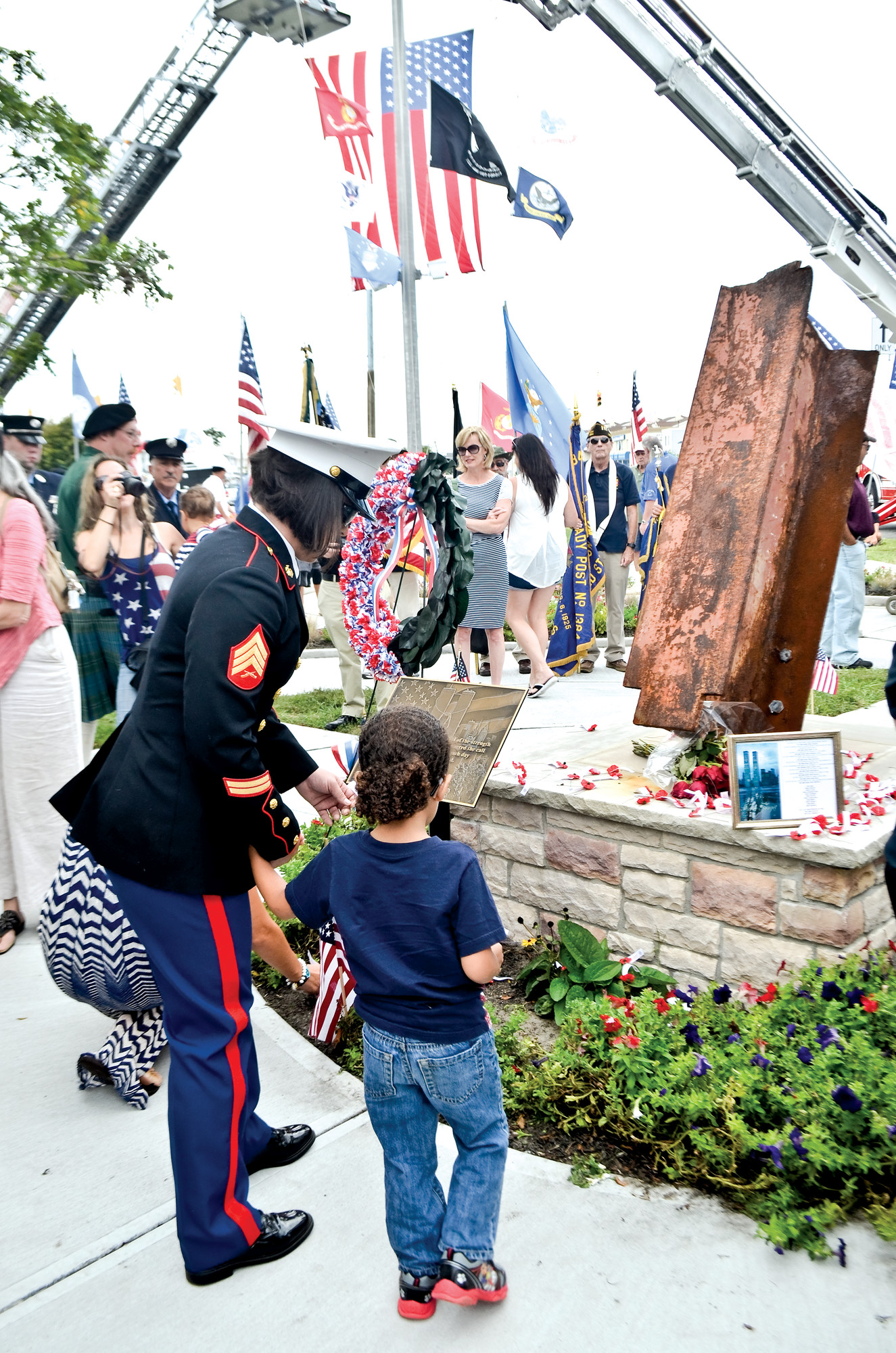 Marine Corps veteran Sgt. Ali Bardeguez-Perkins and her cousin Nikolas were among the roughly 200 residents who gathered at the VFW Plaza last Sunday, where a steel beam from the World Trade Center was dedicated to the first responders and other victims of the attacks on Sept. 11, 2001.