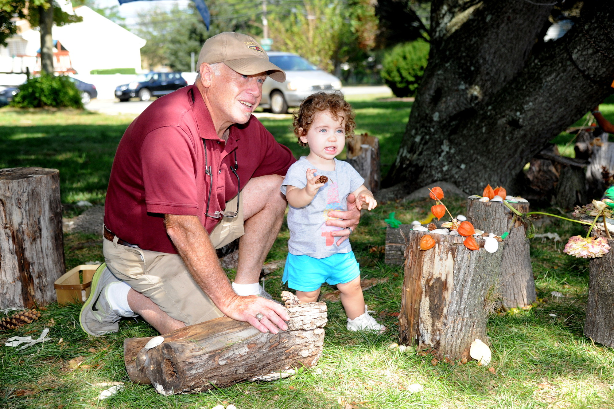 Tim Sena helped his granddaughter, Ella Saputo, make a fairy house.