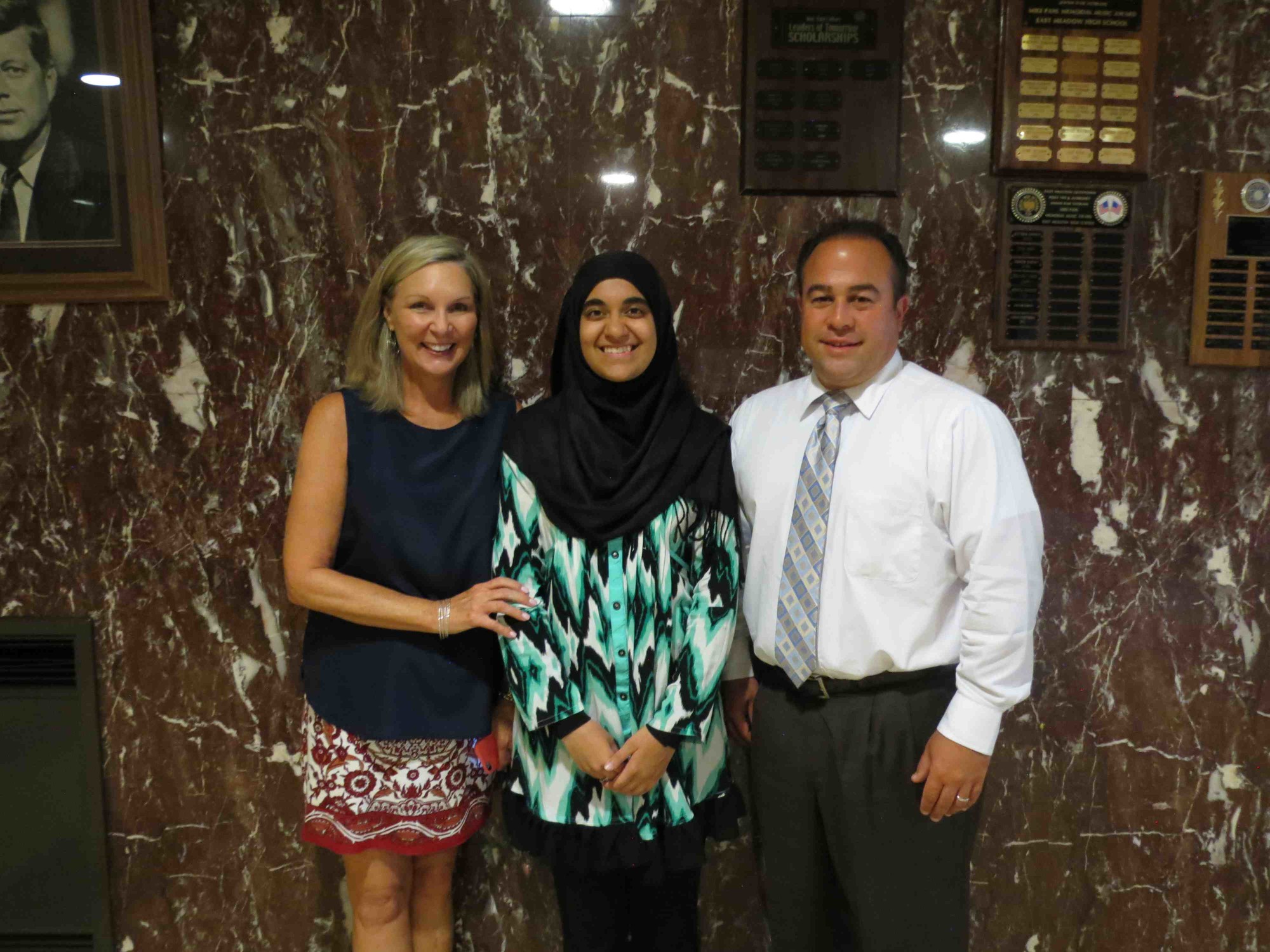 Zainab Nathani, of East Meadow High School, was recently named a semifinalist in the prestigious National Merit Scholarship Competition. She was congratulated by her guidance counselor, Joan Tomlin, and Principal Richard Howard.