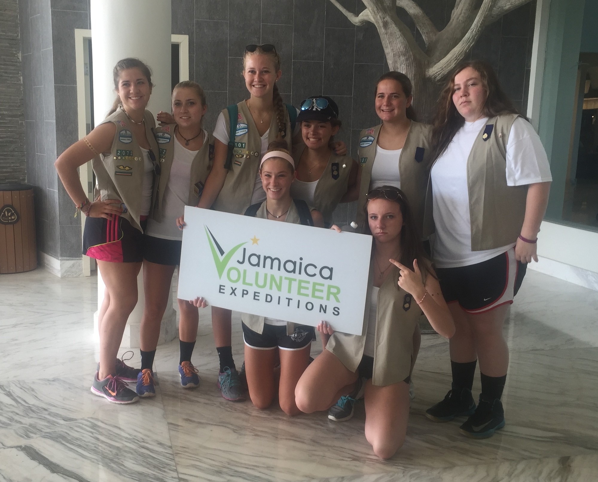 The Girl Scouts after their arrival in Jamaica: Standing from left were Rachael Putelo, Nora Louw, Sarah Jaskowiak, Joanna Ambrosio, Jessica Loyer and Kim McGeary; kneeling were Kiersten Cote, left, and Kiera Popp.